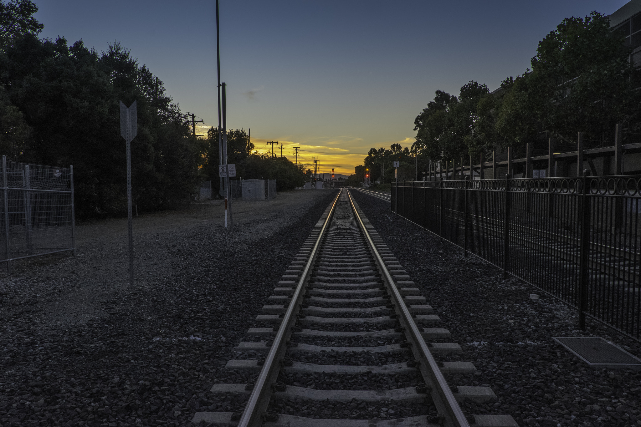 Fujifilm X-E2 + Fujifilm XF 18-135mm F3.5-5.6 R LM OIS WR sample photo. Sunrise on train tracks photography