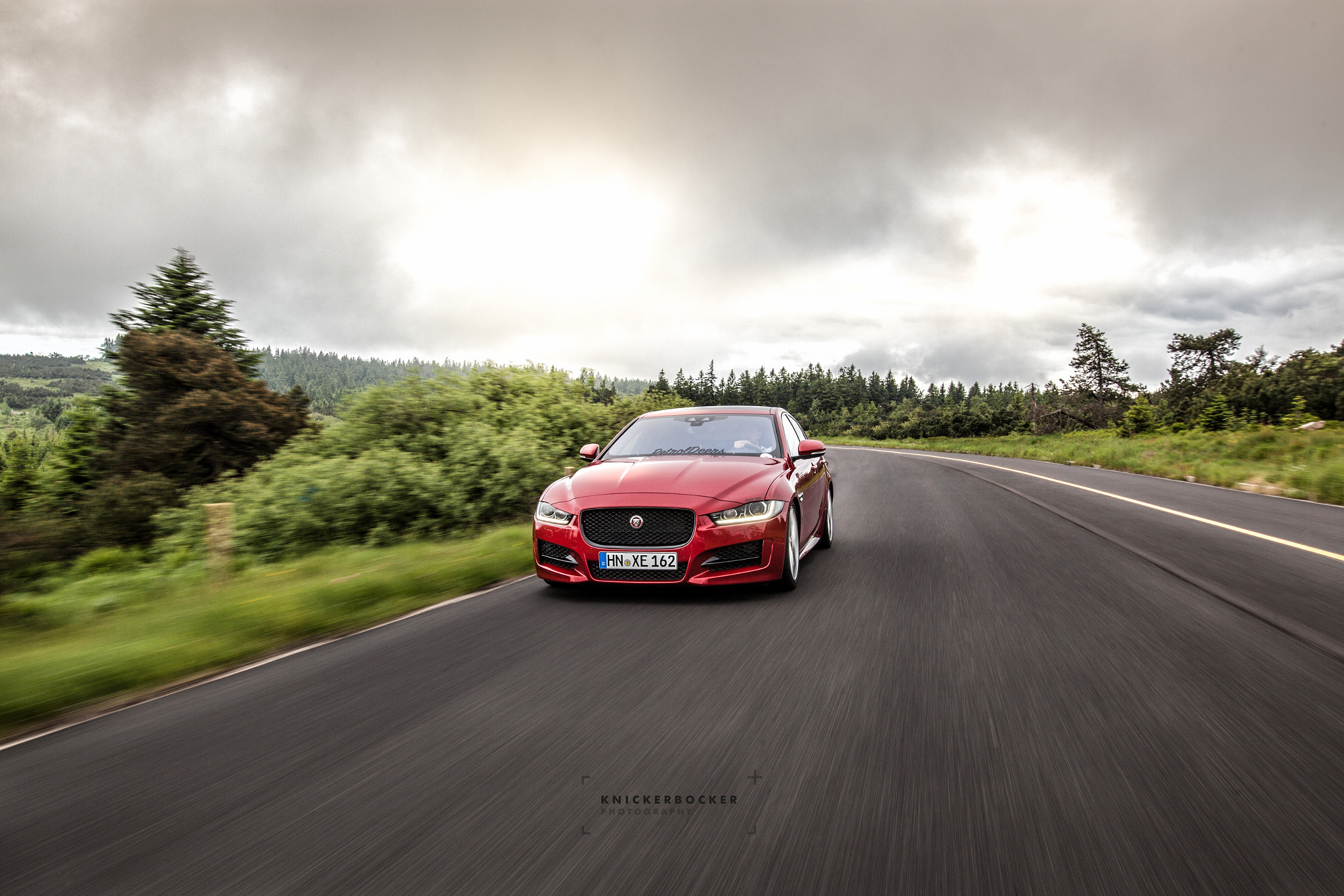 Sigma 24mm F1.4 DG HSM Art sample photo. Jaguar xe rolling shot photography