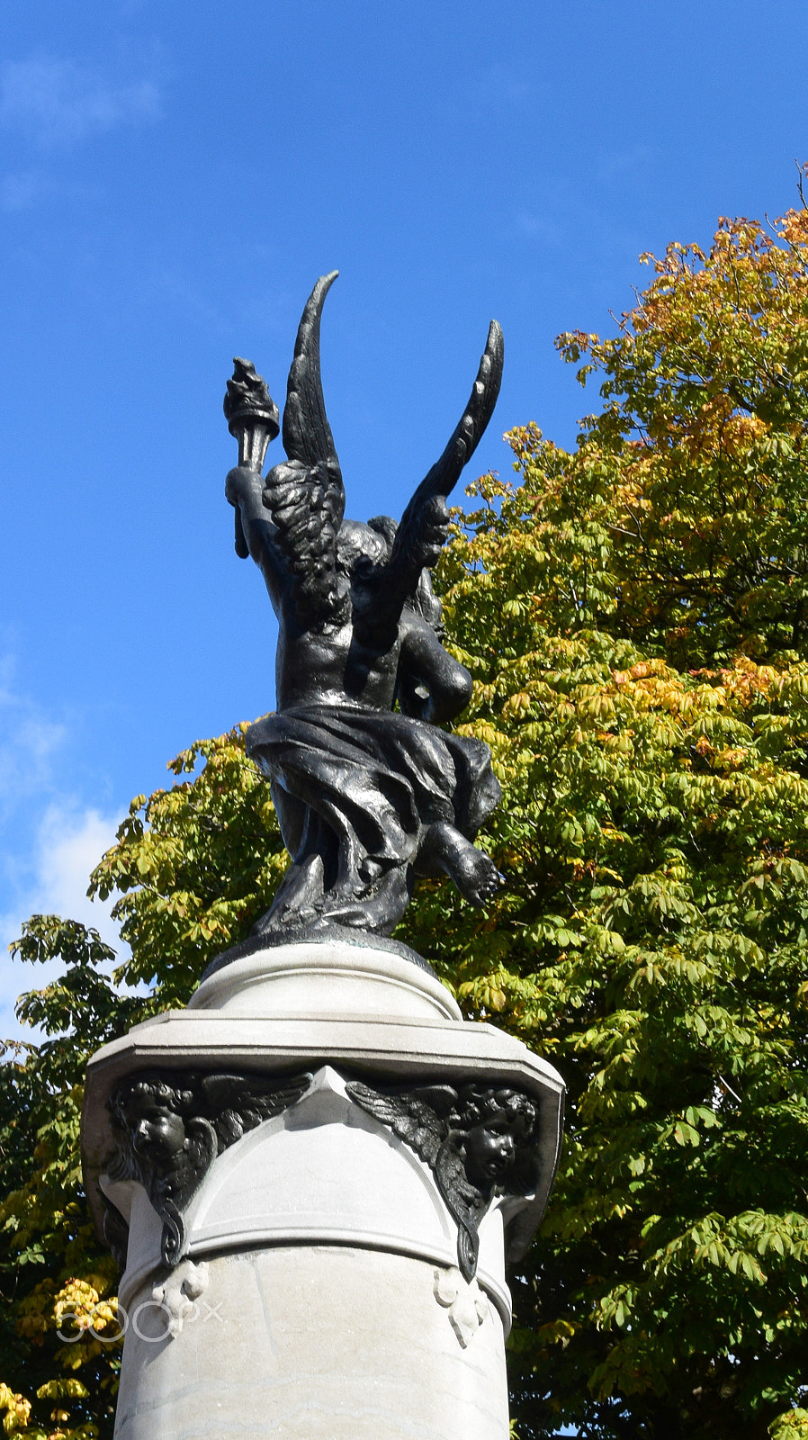 Nikon 1 S2 sample photo. Flying torch reaching blue sky photography