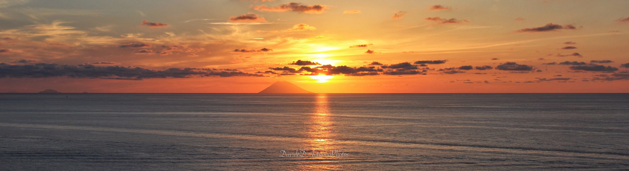 Canon EOS 60D + Canon EF-S 18-135mm F3.5-5.6 IS sample photo. Stromboli at sunset photography