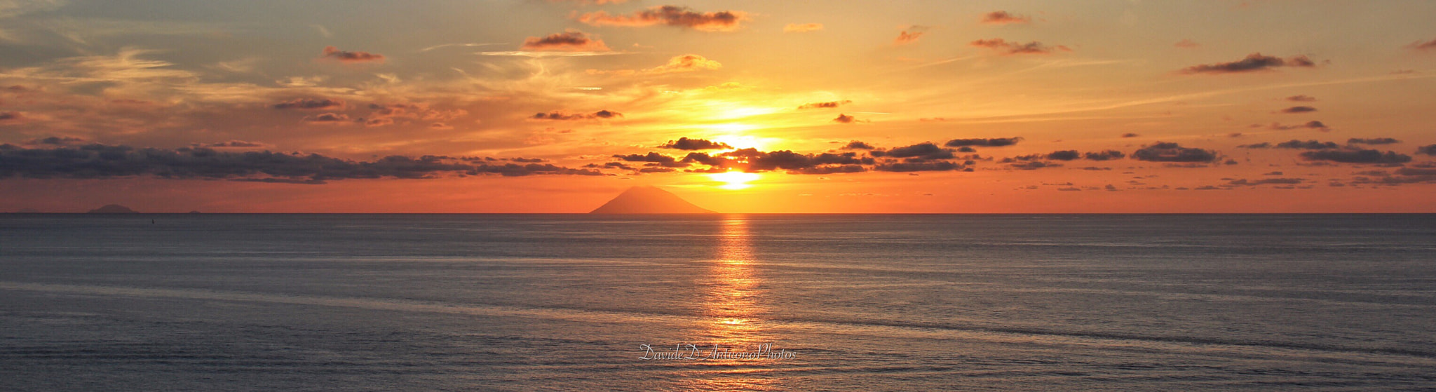 Canon EF-S 18-135mm F3.5-5.6 IS sample photo. Stromboli at sunset photography