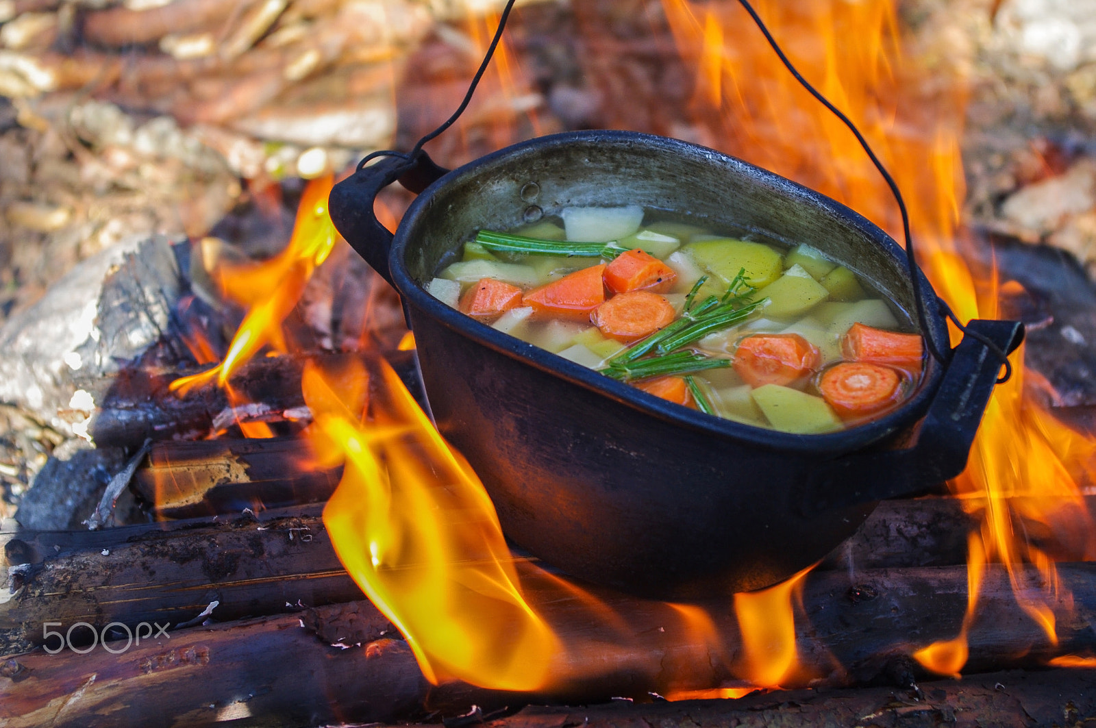 Pentax K-7 sample photo. Vegetables prepared in a cauldron over  fire on the nature photography