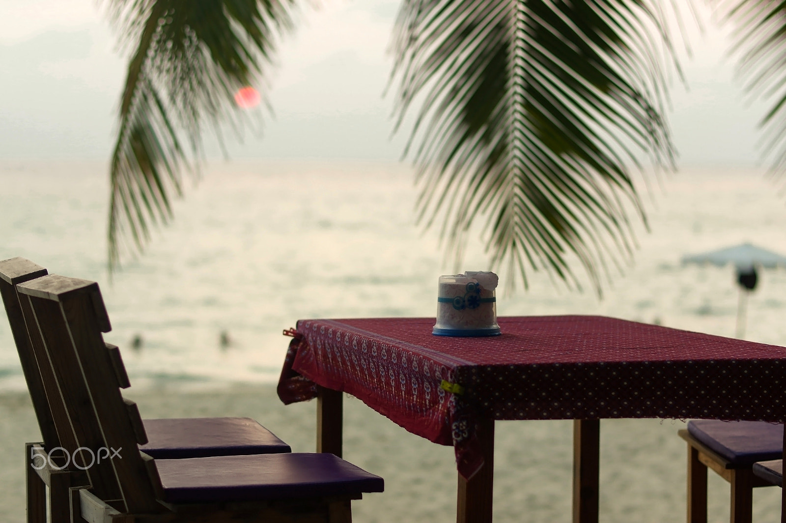 Pentax K-3 sample photo. Romantic outdoor restaurant table and chairs at the beach on sun photography