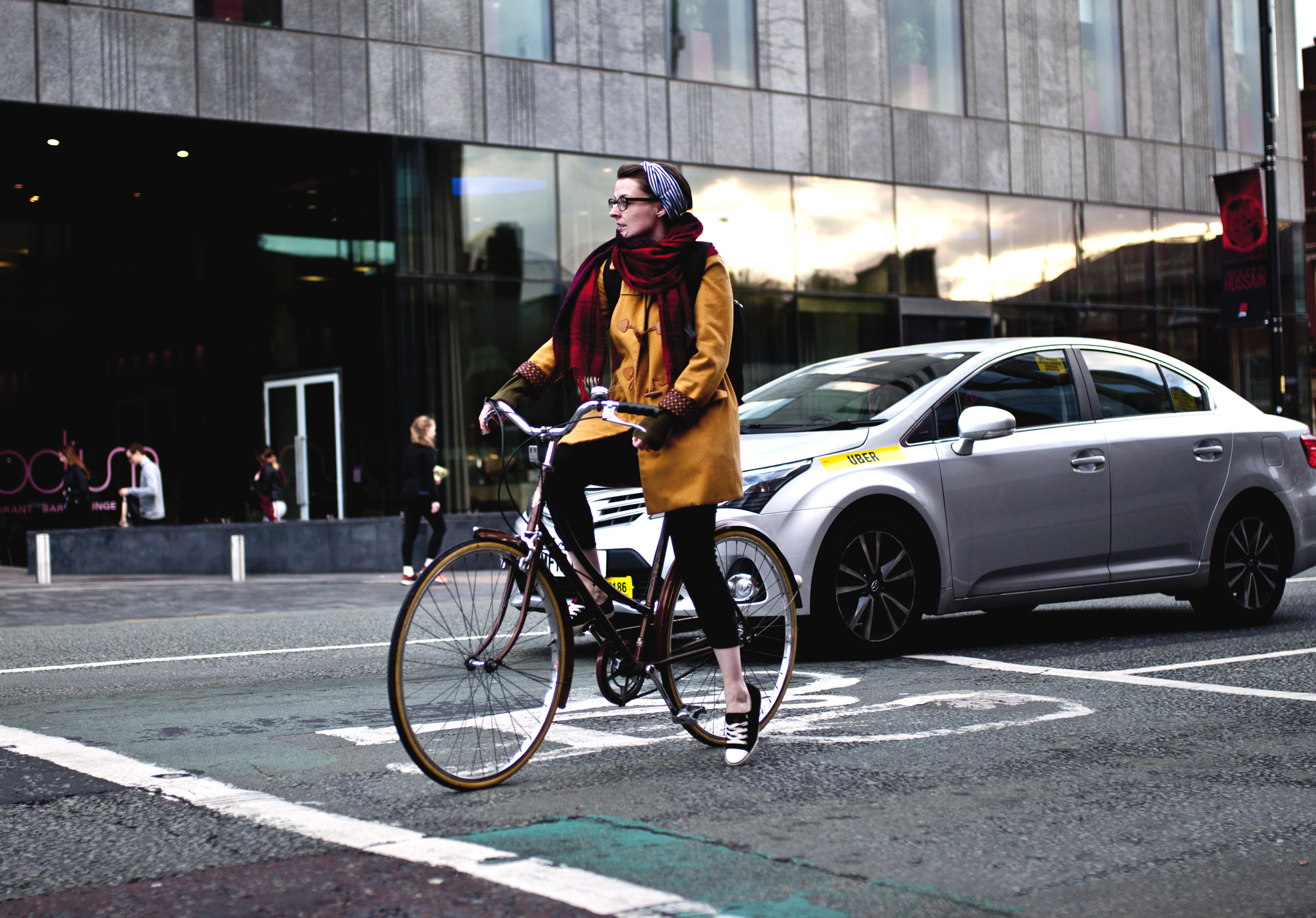 Nikon D90 + Sigma 35mm F1.4 DG HSM Art sample photo. A lady on a bike photography