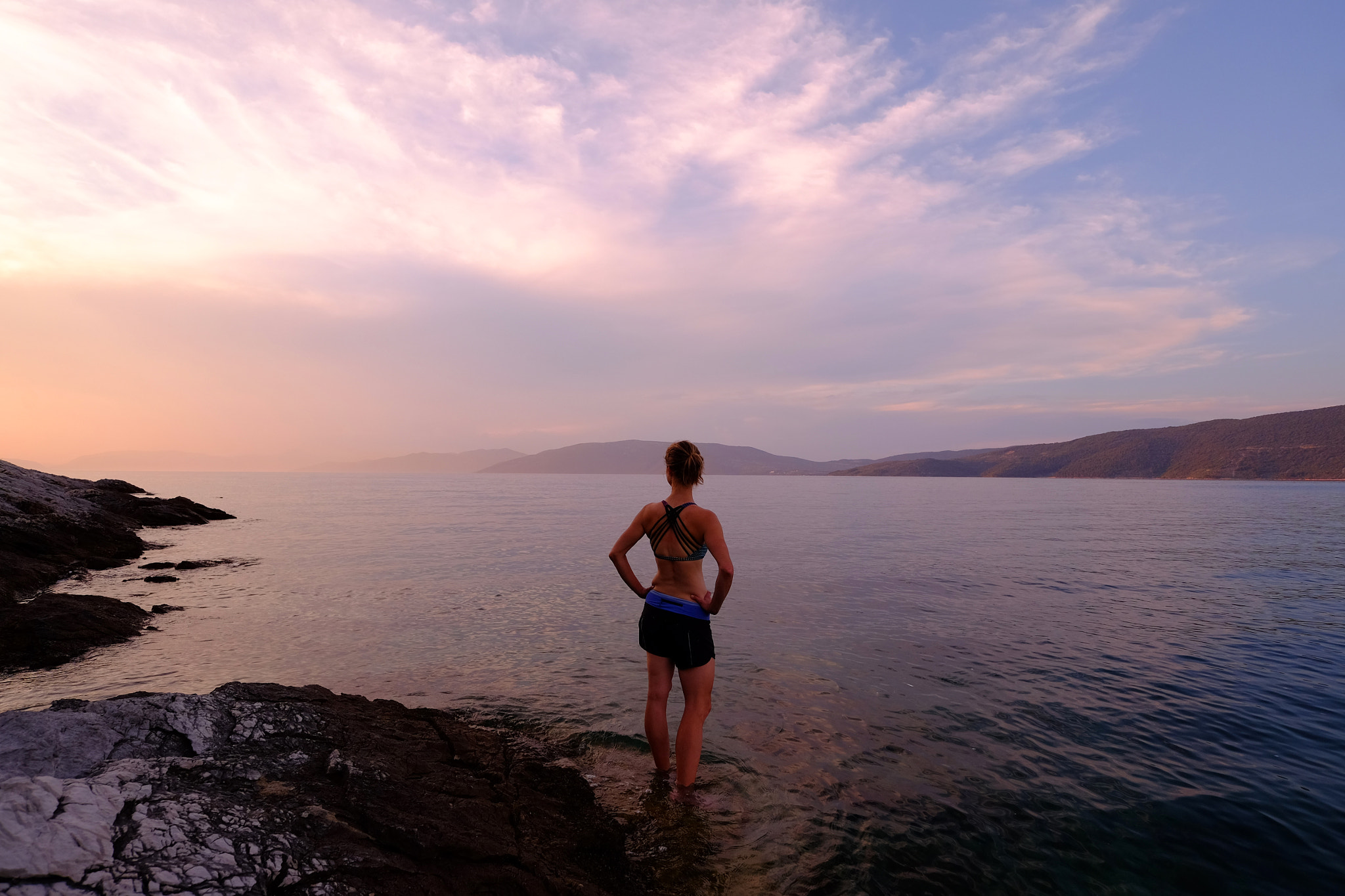 Fujifilm X-T1 + ZEISS Touit 12mm F2.8 sample photo. Woman in adriatic sea at sunset, croatia photography