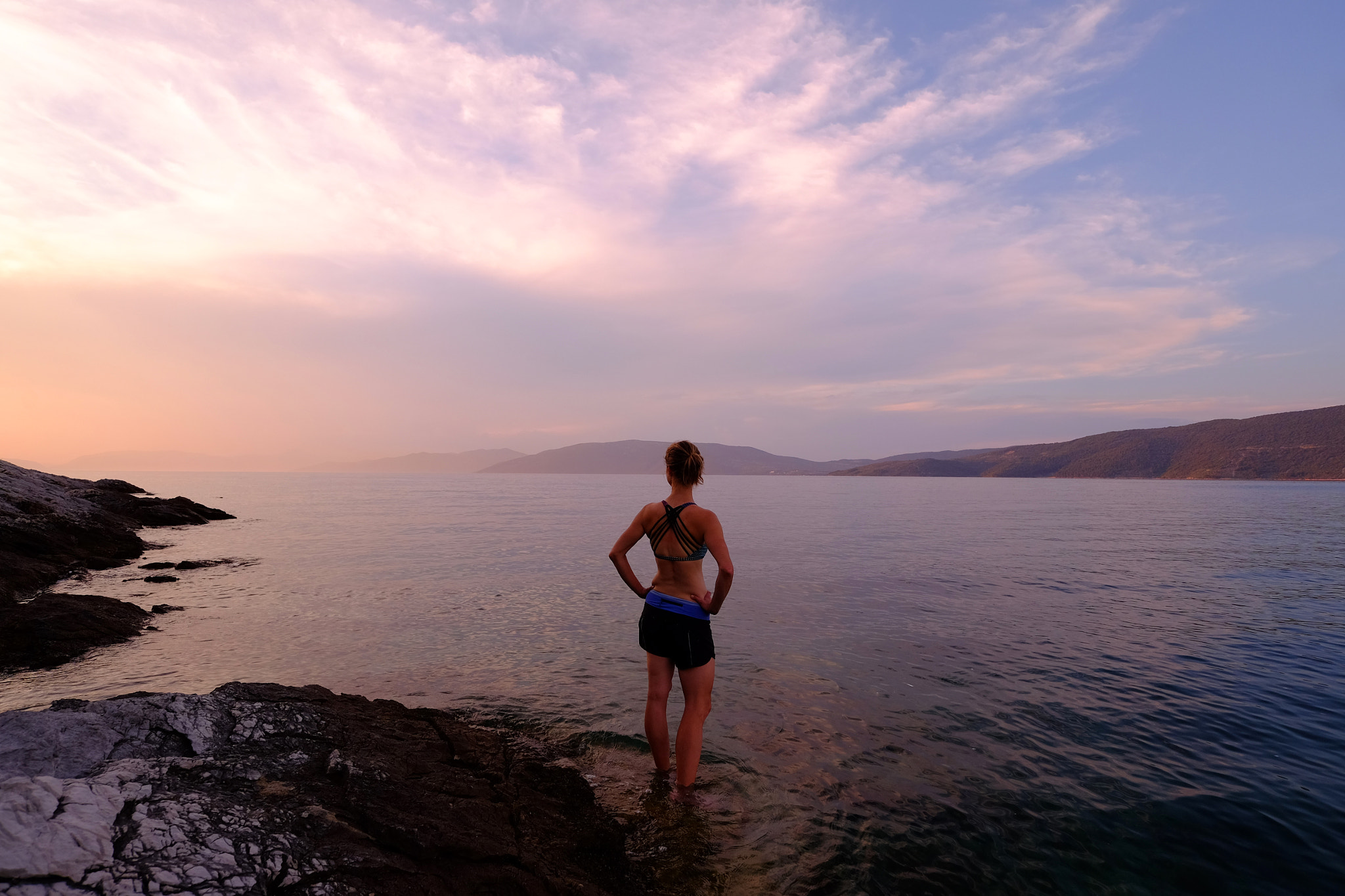 ZEISS Touit 12mm F2.8 sample photo. Woman in adriatic sea at sunset, croatia photography
