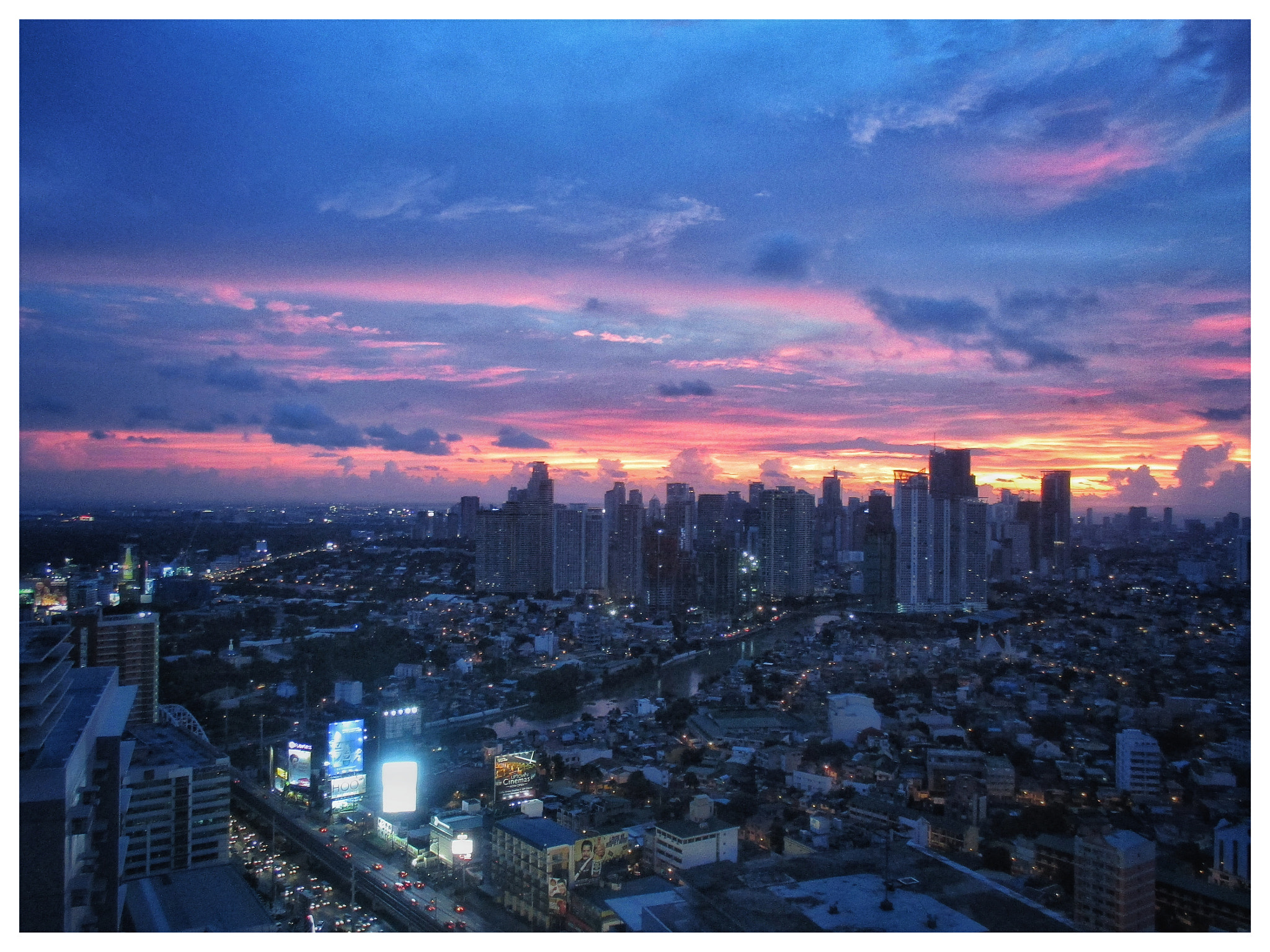 Canon PowerShot ELPH 135 (IXUS 145 / IXY 120) sample photo. Sunset over metro manila photography