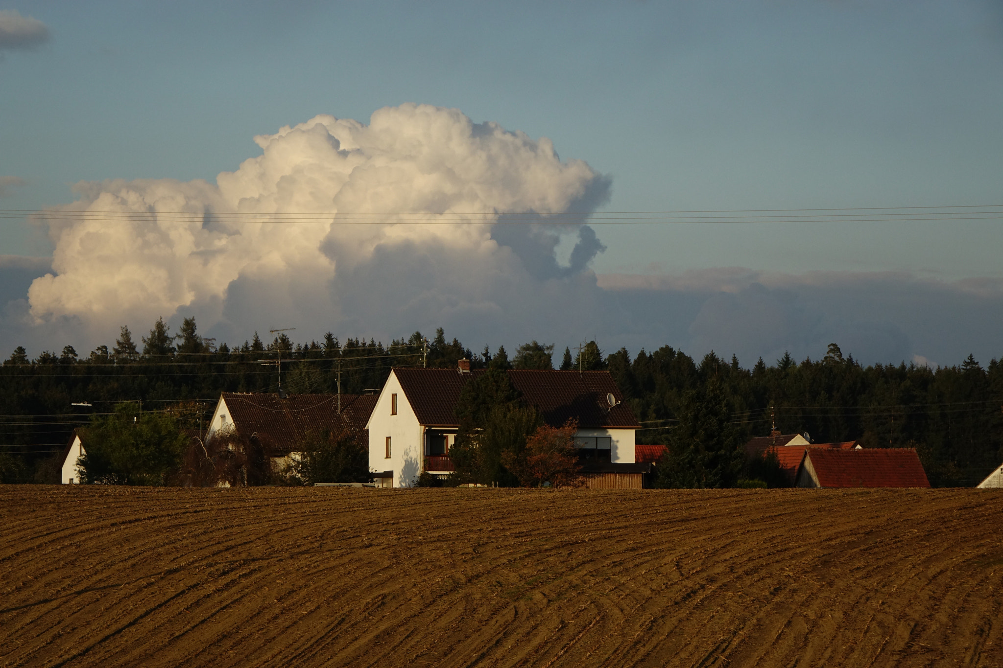 Sony Cyber-shot DSC-RX10 + Sony 24-200mm F2.8 sample photo. Sunset in the village photography