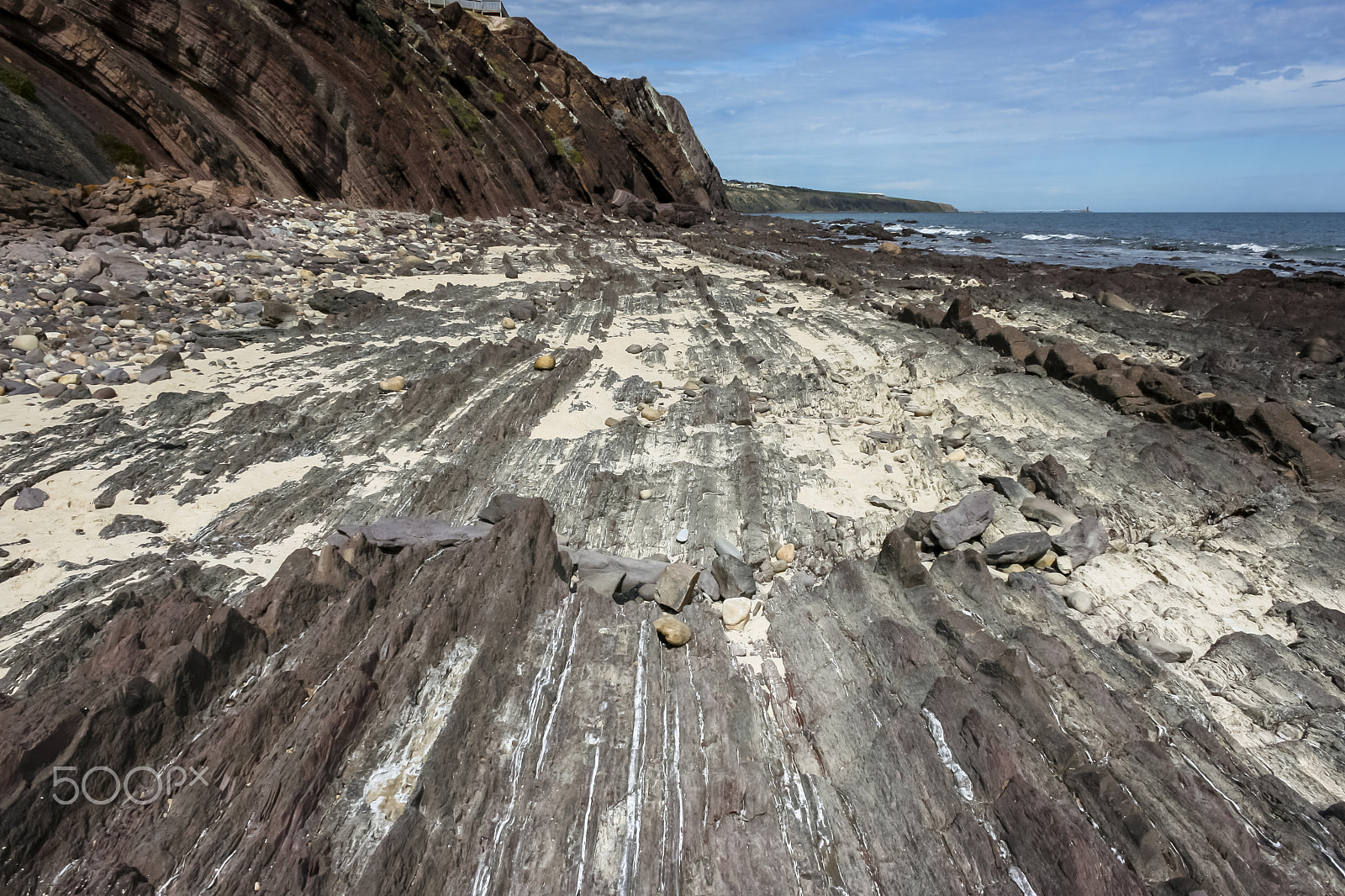 Canon EF-S 18-55mm f/3.5-5.6 USM sample photo. Sedimentary rocks beach photography