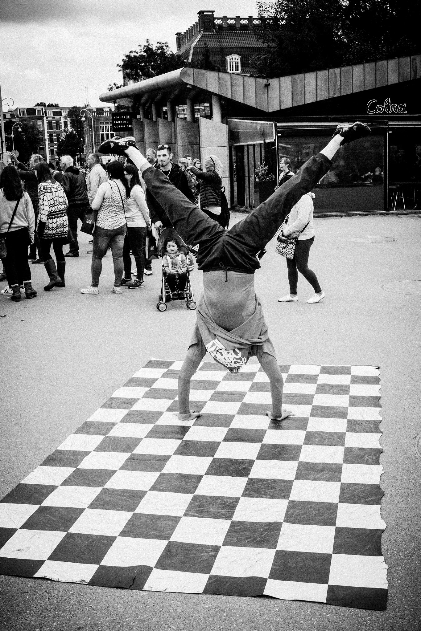 Canon EF-S 24mm F2.8 STM sample photo. Streetperformer ~ amsterdam photography