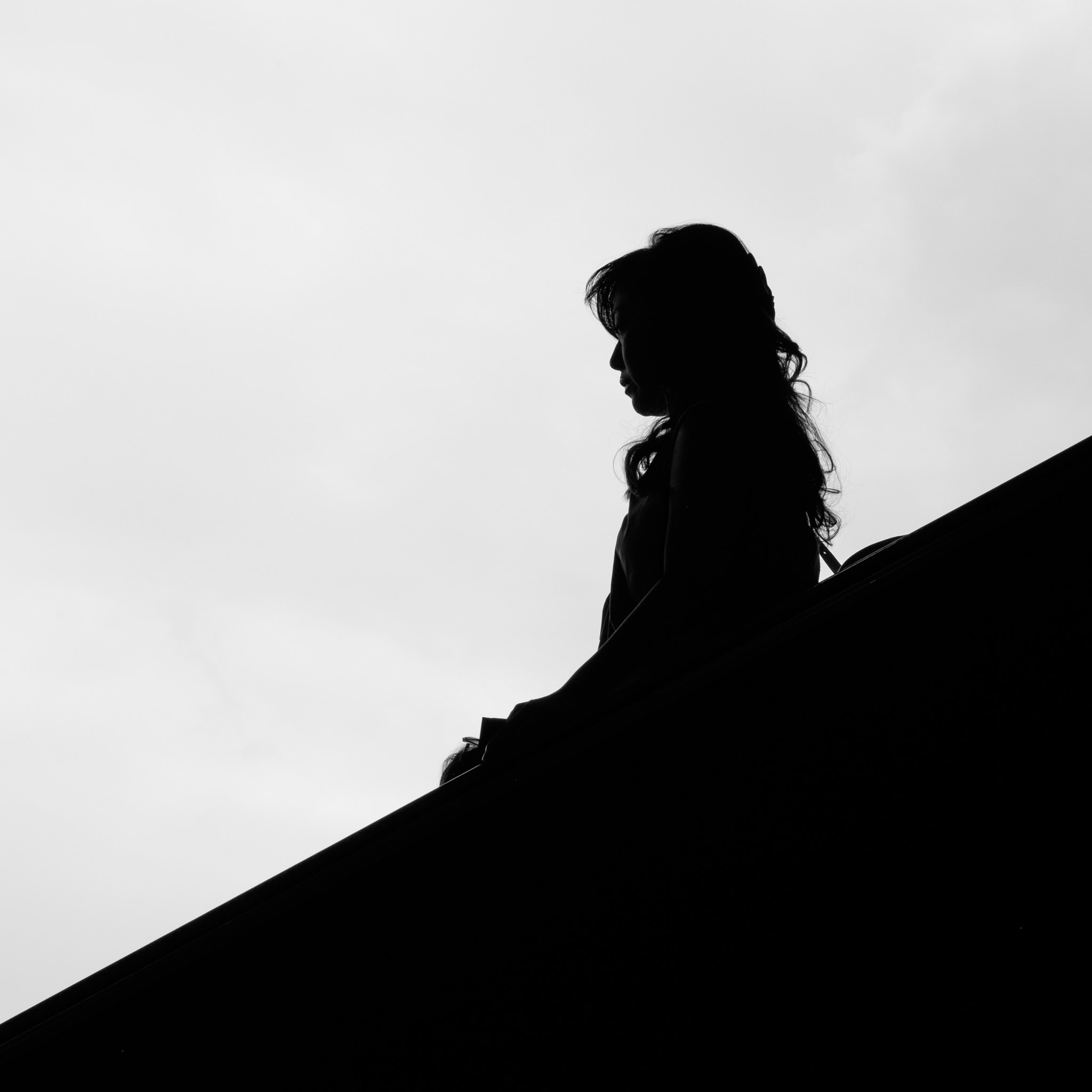 Fujifilm XF 56mm F1.2 R sample photo. Descending woman photography