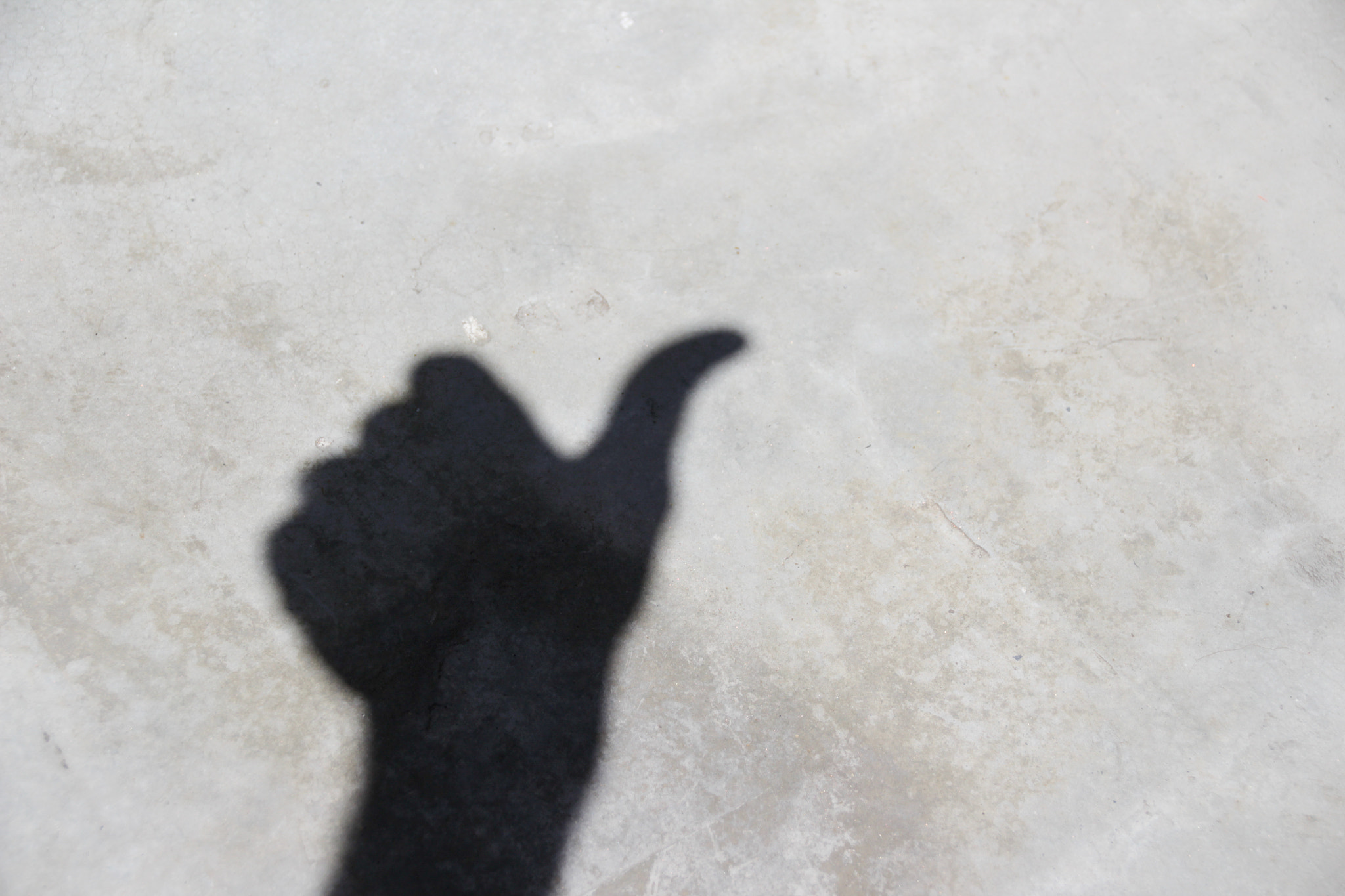 Sigma 18-250mm F3.5-6.3 DC OS HSM sample photo. Human hand shadow on floor photography