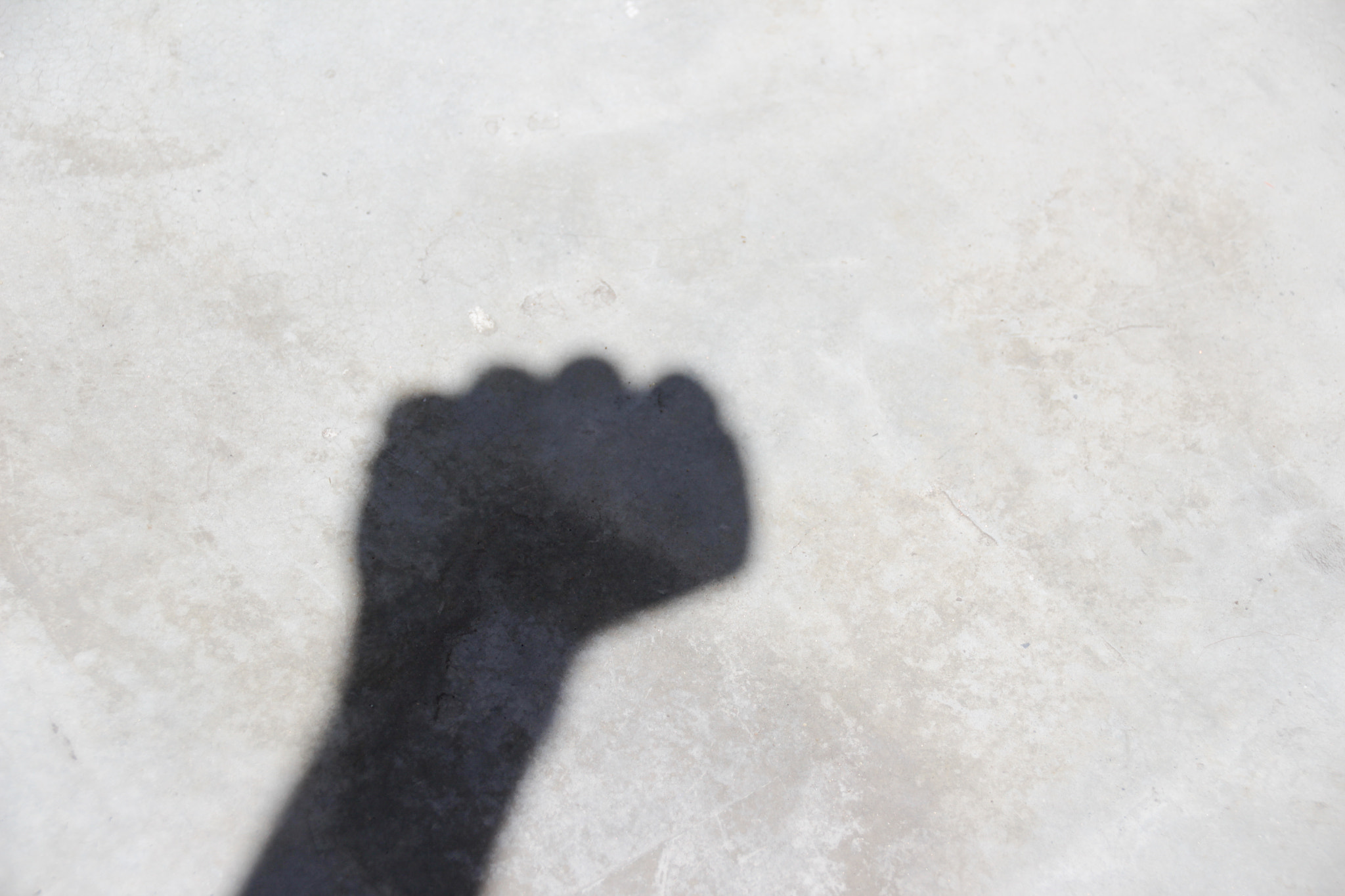 Sigma 18-250mm F3.5-6.3 DC OS HSM sample photo. Human hand shadow on floor photography