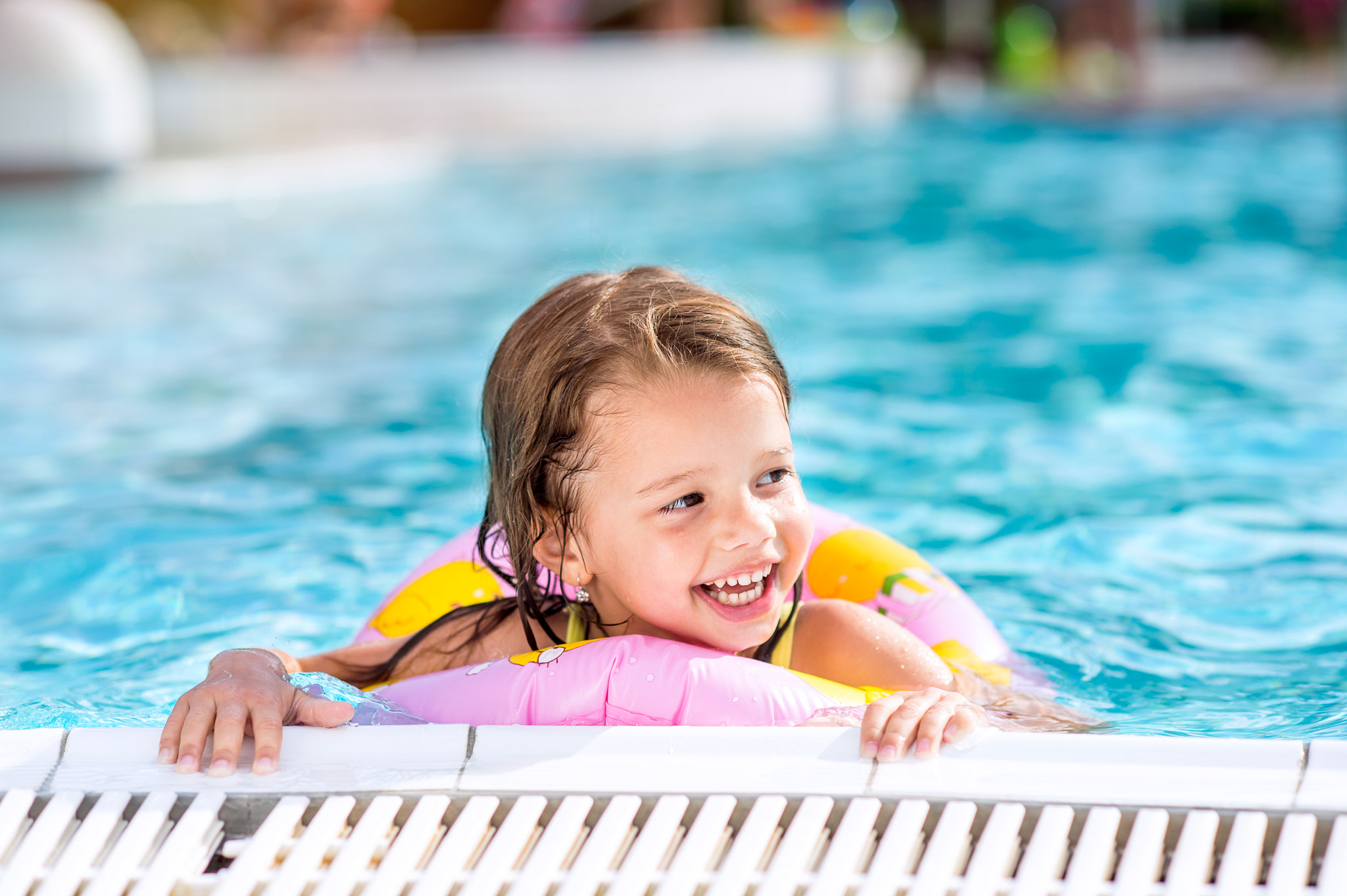 Nikon D4S + Nikon AF Nikkor 85mm F1.8D sample photo. Girl lying in swimming pool. summer heat and water. photography