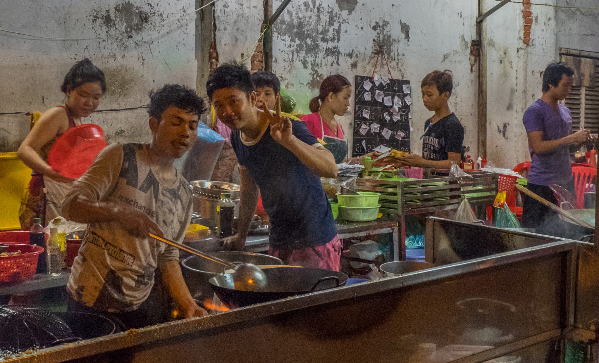 Olympus OM-D E-M1 + Olympus Zuiko Digital ED 9-18mm F4.0-5.6 sample photo. Street food at night in ho chi minh city, vietnam photography