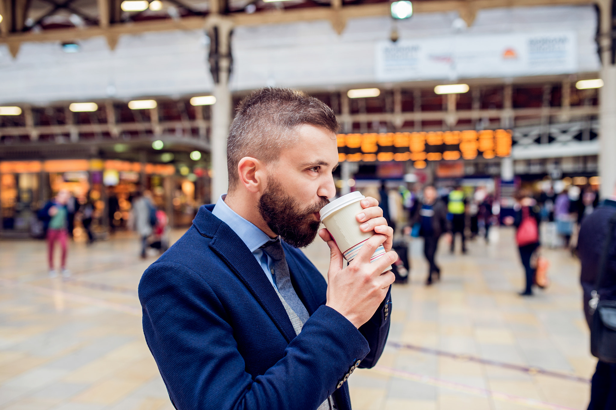 Nikon D4S + Sigma 35mm F1.4 DG HSM Art sample photo. Hipster businessman drinking coffee at the train station photography