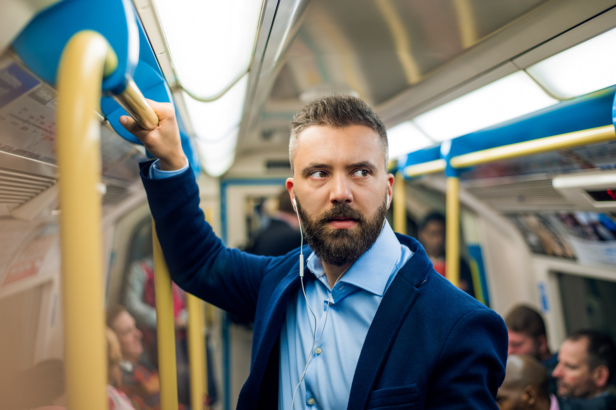 Nikon D4S sample photo. Serious businessman travelling to work. standing inside undergro photography
