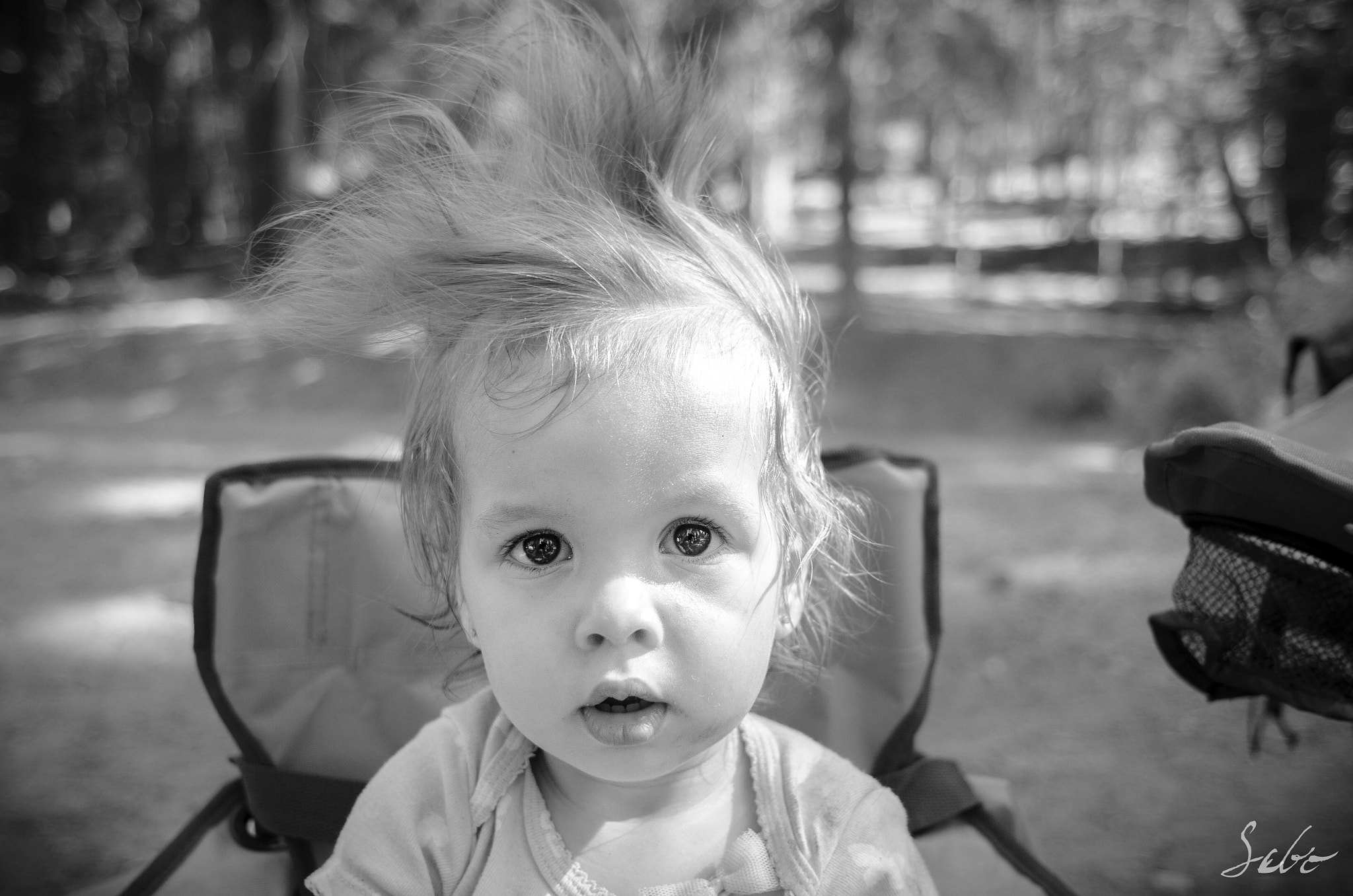 Nikon D7000 + Nikon AF Nikkor 24mm F2.8D sample photo. My niece's reaction shortly after tearing out her hair band. photography