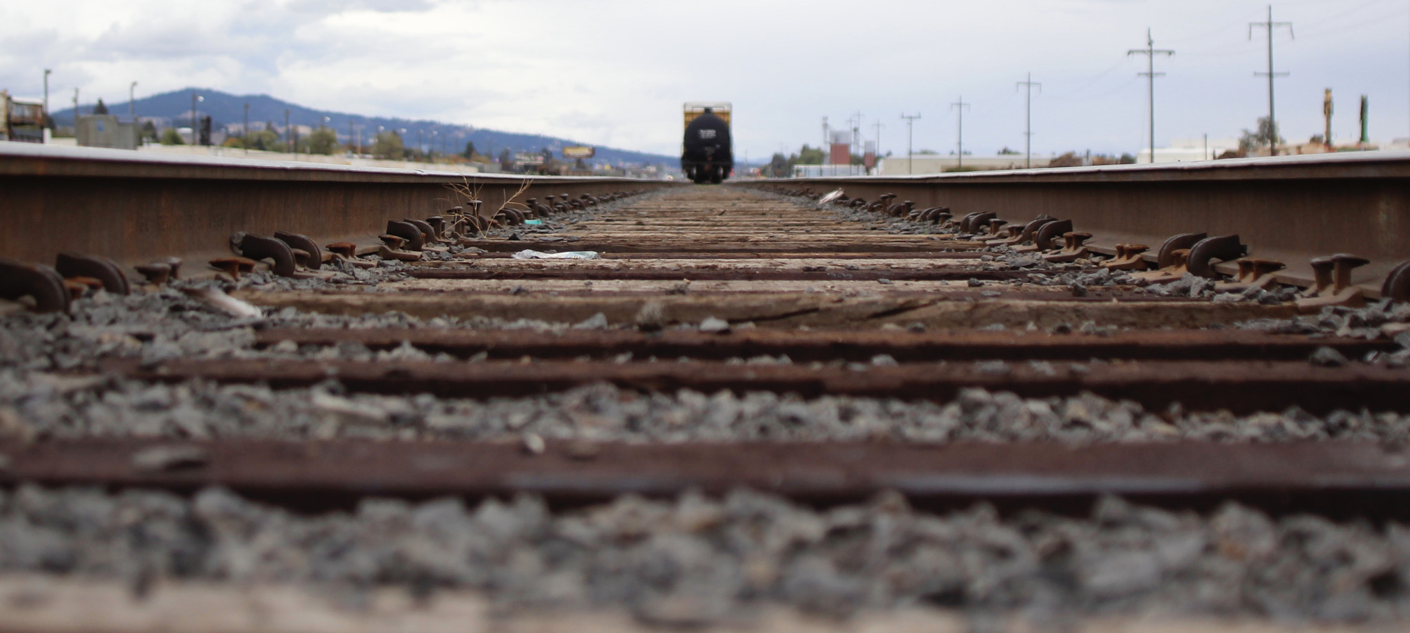 Canon EOS 1200D (EOS Rebel T5 / EOS Kiss X70 / EOS Hi) + Canon EF 20-35mm f/2.8L sample photo. Railway with a train parked photography