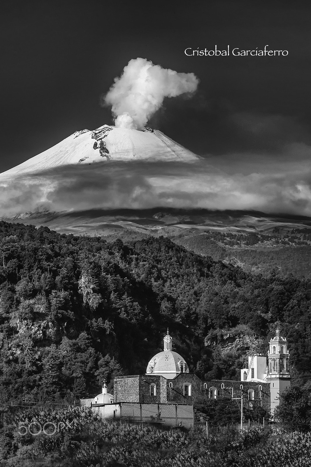 Canon EOS-1Ds Mark II + Canon EF 70-200mm F2.8L IS USM sample photo. Church and smoking volcano photography