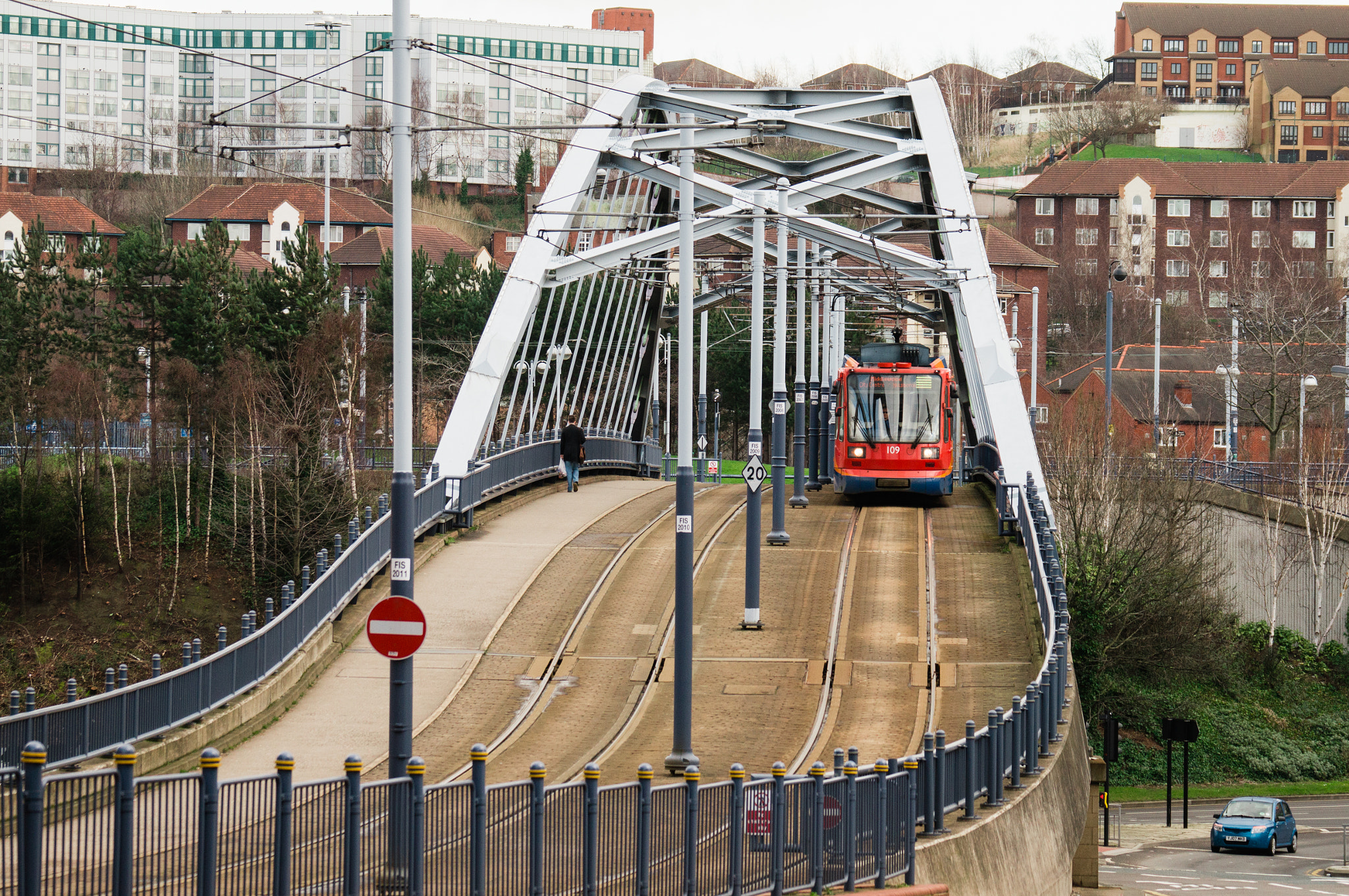 Sony 70-300mm F4.5-5.6 G SSM sample photo. Man, tram and car photography