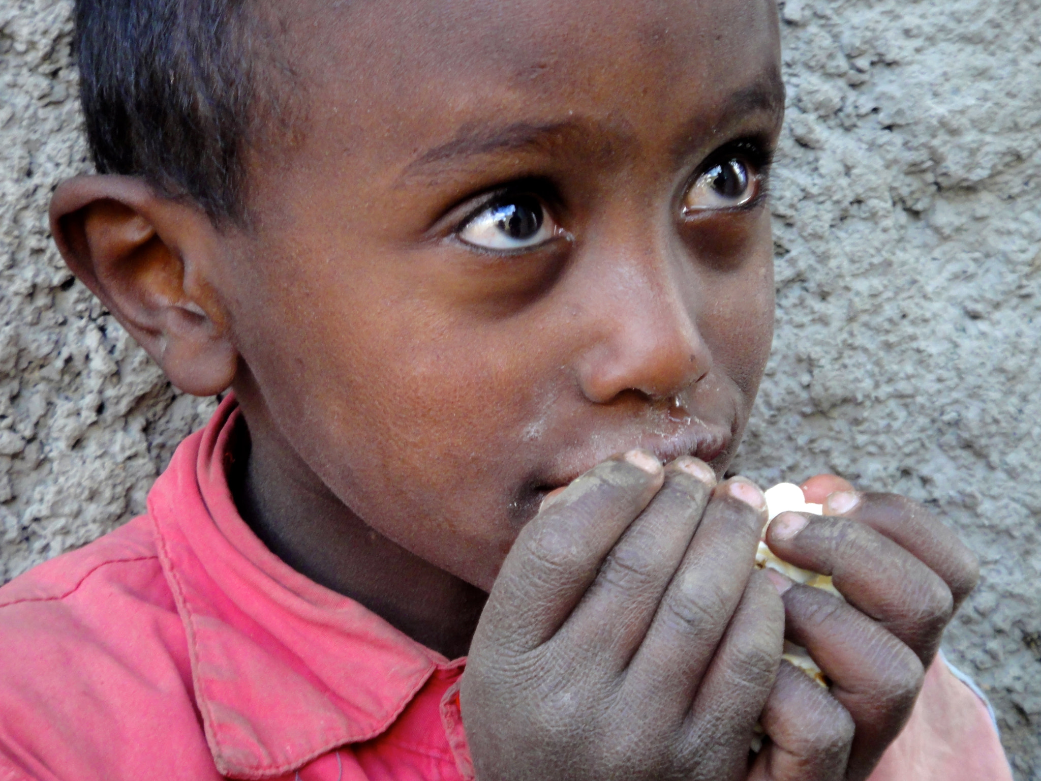 Sony DSC-TX7 sample photo. Ethiopia, dessie, sweet face, little boy, eating, hungry, happy, red shirt, big eyes, village... photography