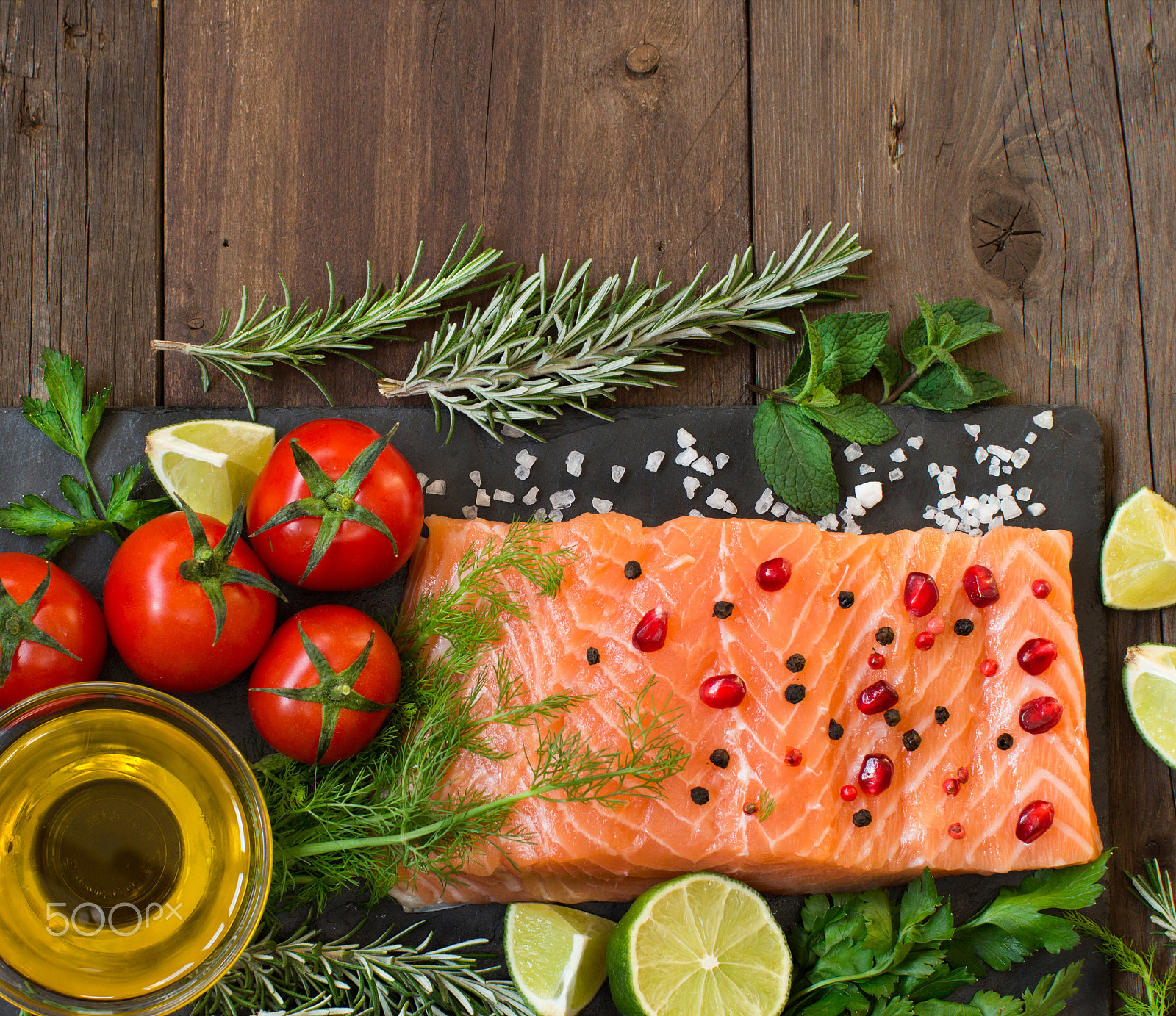 Canon EOS 650D (EOS Rebel T4i / EOS Kiss X6i) + Canon EF 50mm F1.2L USM sample photo. Salmon with vegetables, olive oil and herbs photography