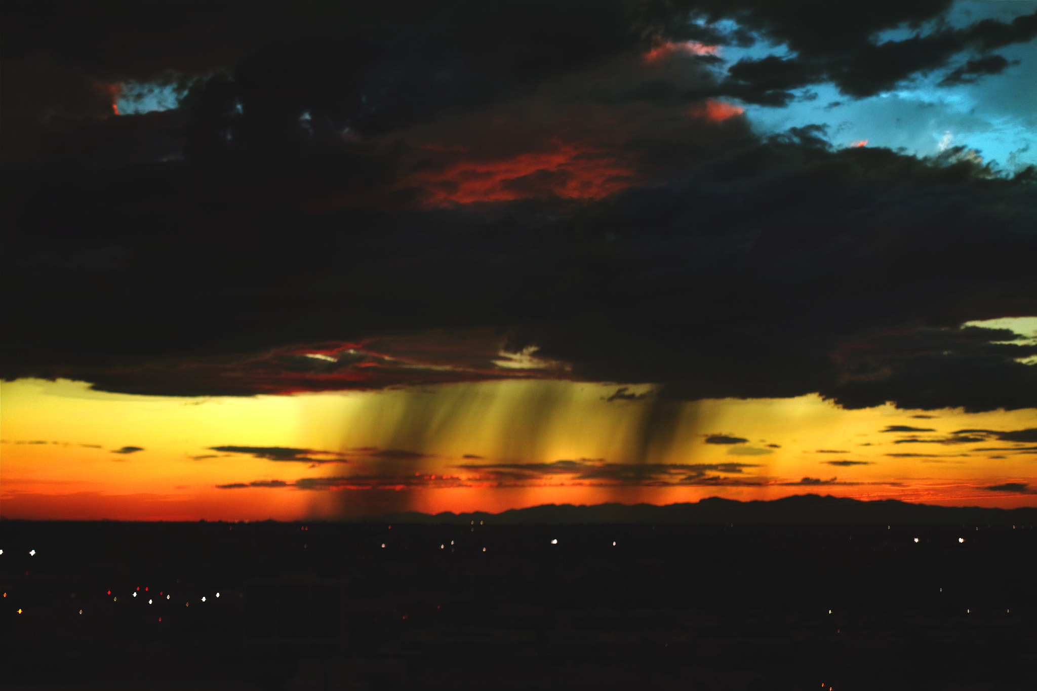 Canon EF 35-80mm f/4-5.6 sample photo. Distant autumn rain at dusk photography