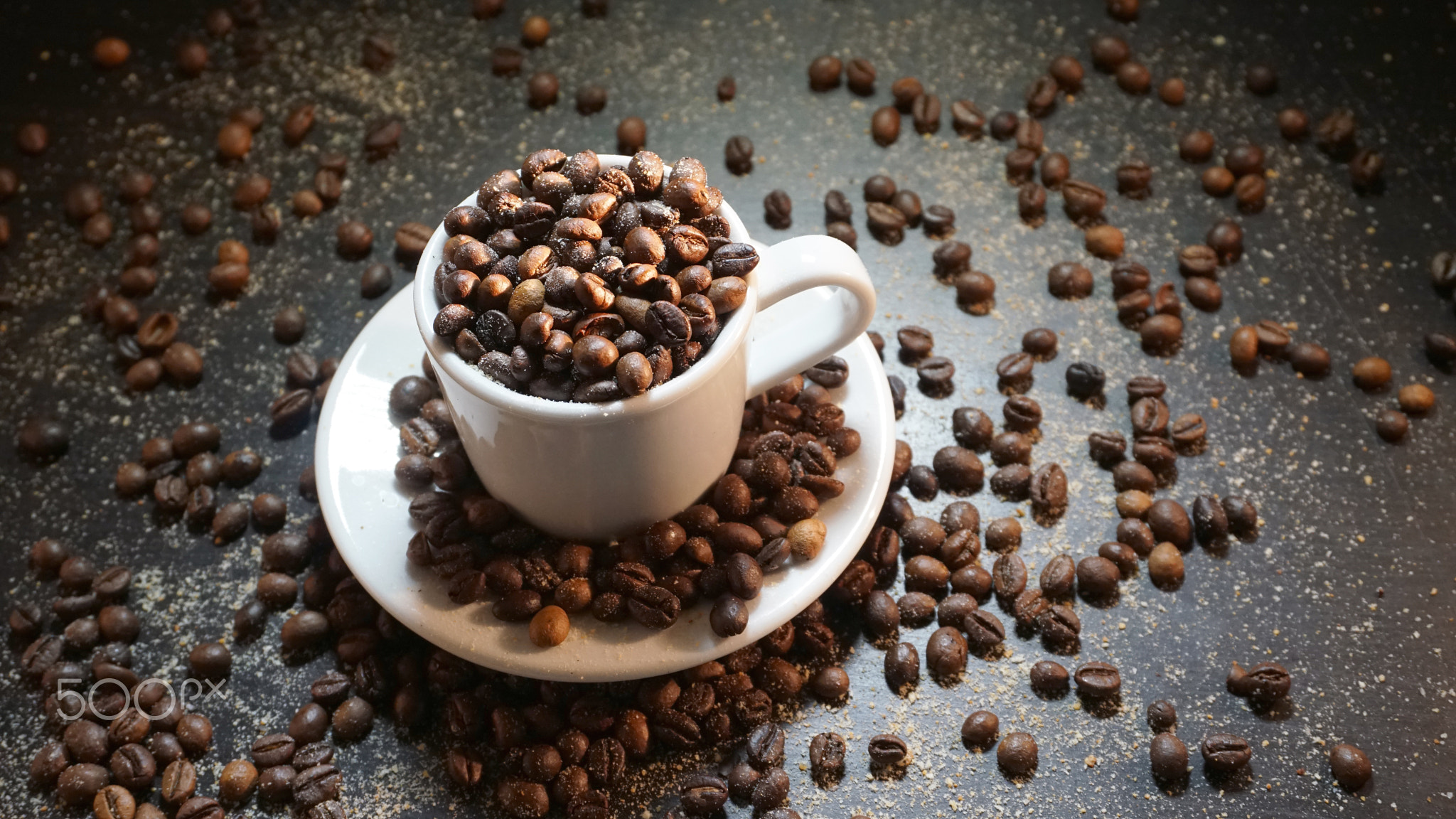 White Cup With Coffee Beans on Black Background