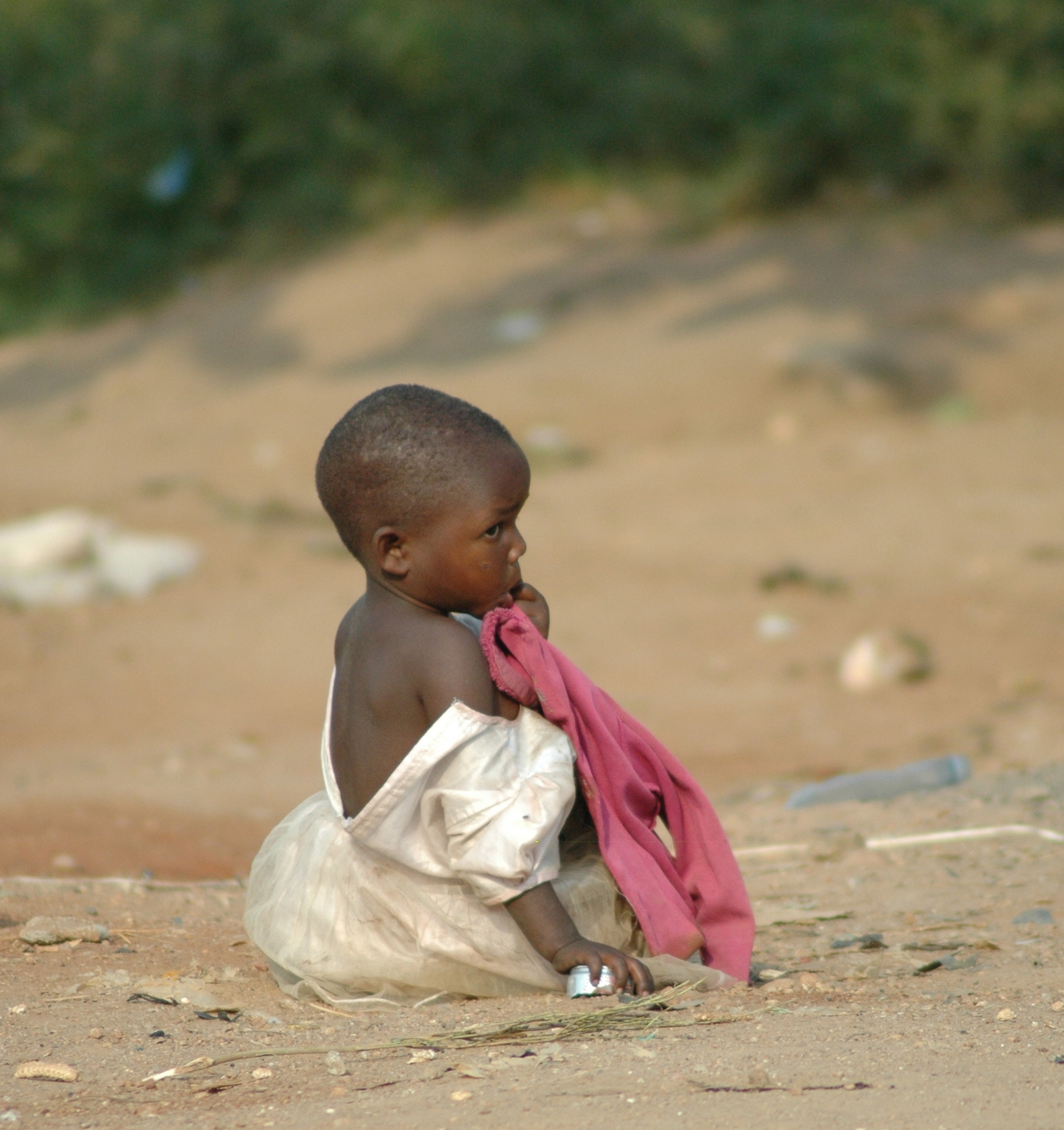 Nikon D70s + Tamron AF 70-300mm F4-5.6 Di LD Macro sample photo. Uganda, africa, east africa, little girl, party dress, dirt road, village child photography