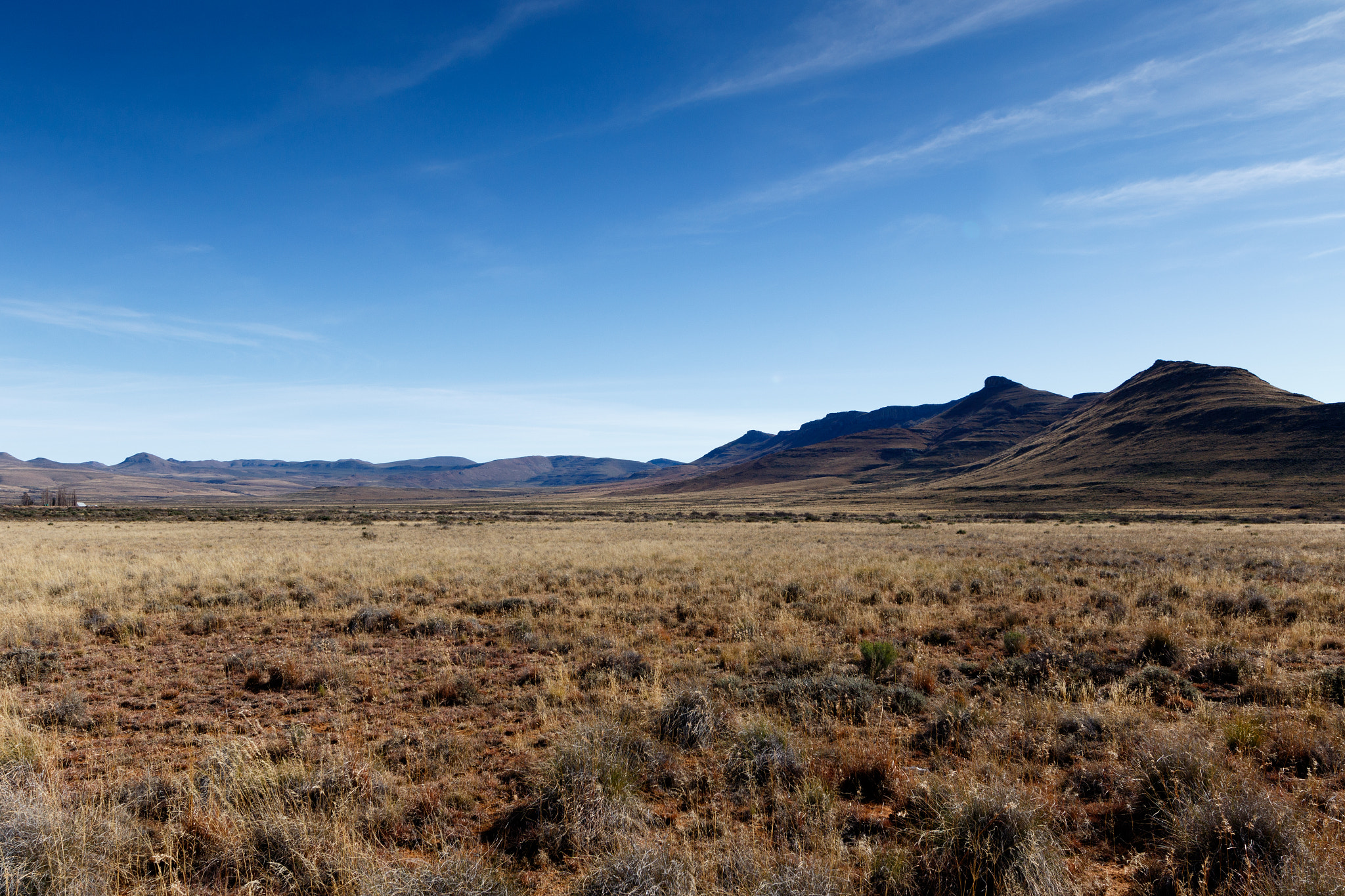 Canon EF 300mm f/2.8L sample photo. Mountains with blue sky and yellow fields - graaff-reinet  photography