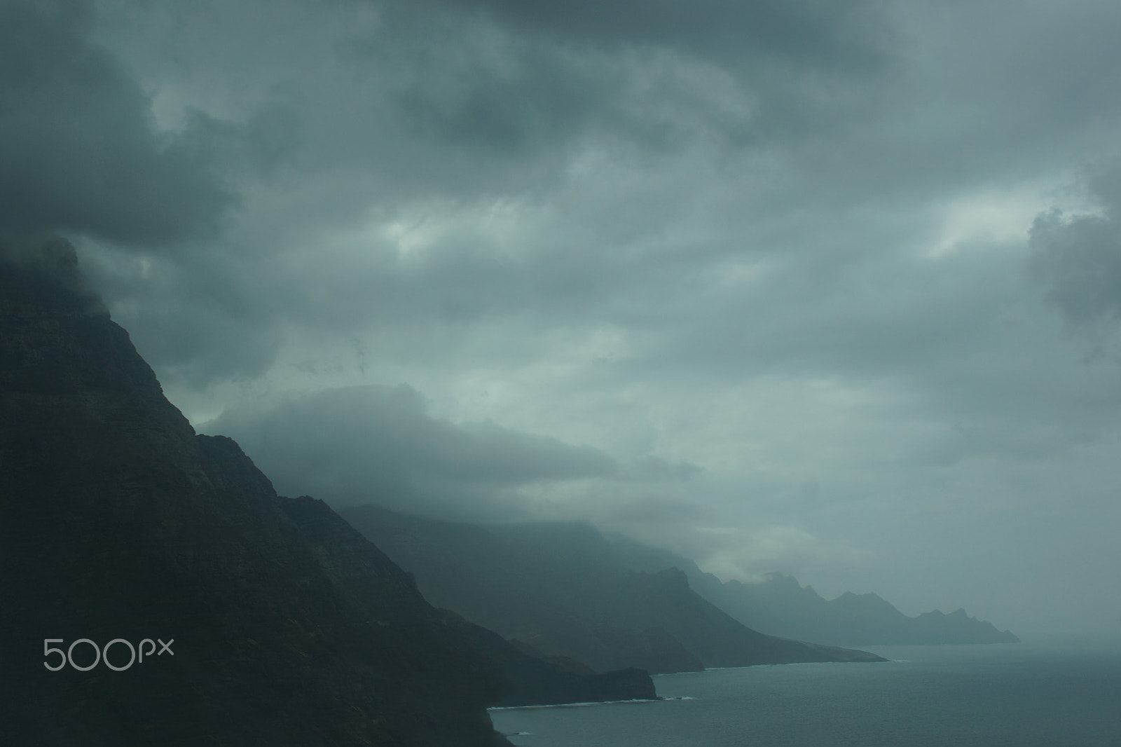Sony SLT-A65 (SLT-A65V) sample photo. Mountain silhouettes at the sea photography