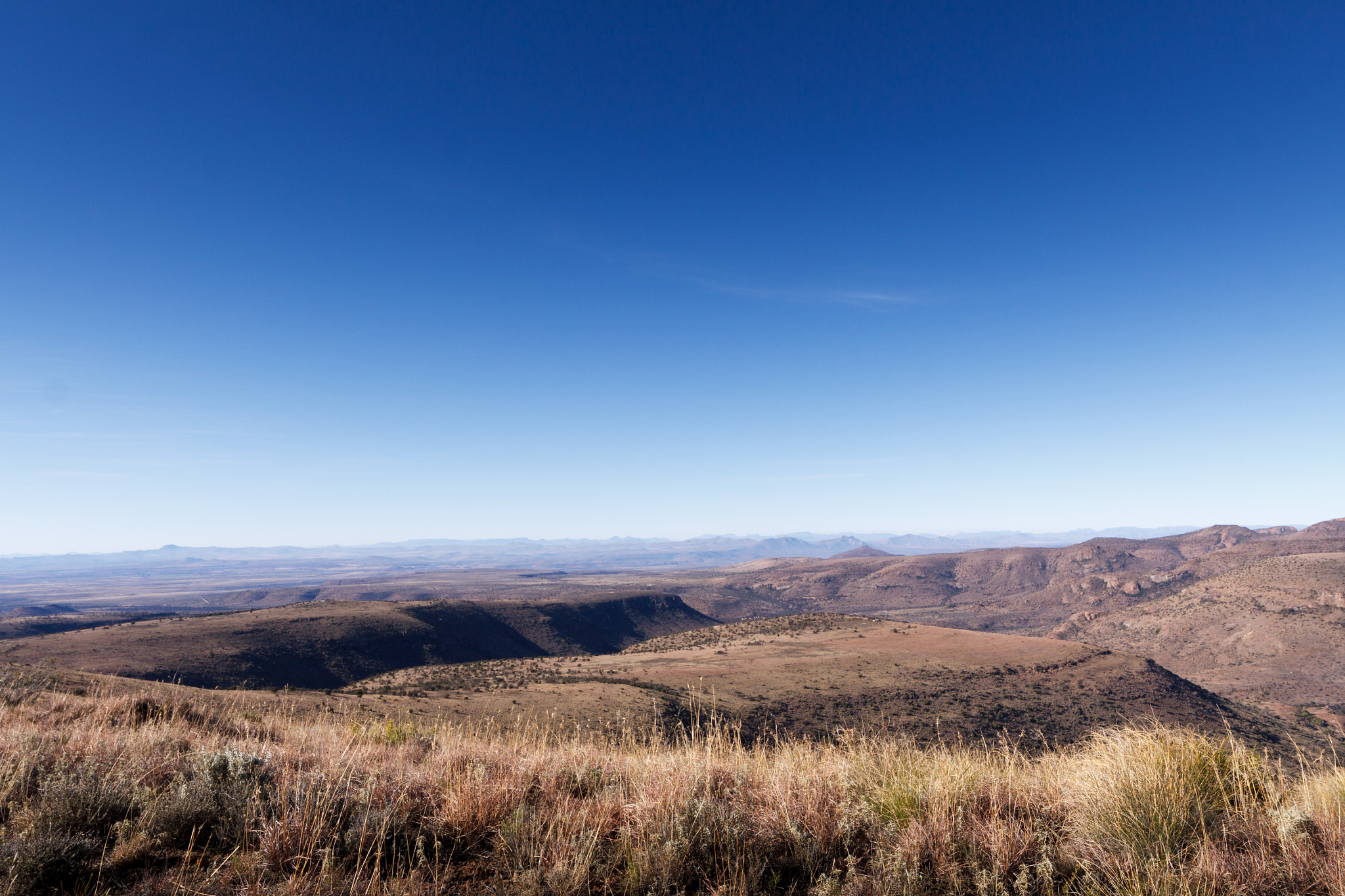 Canon EOS 50D + Canon EF 300mm f/2.8L sample photo. Beautiful green barren valley with mountains photography