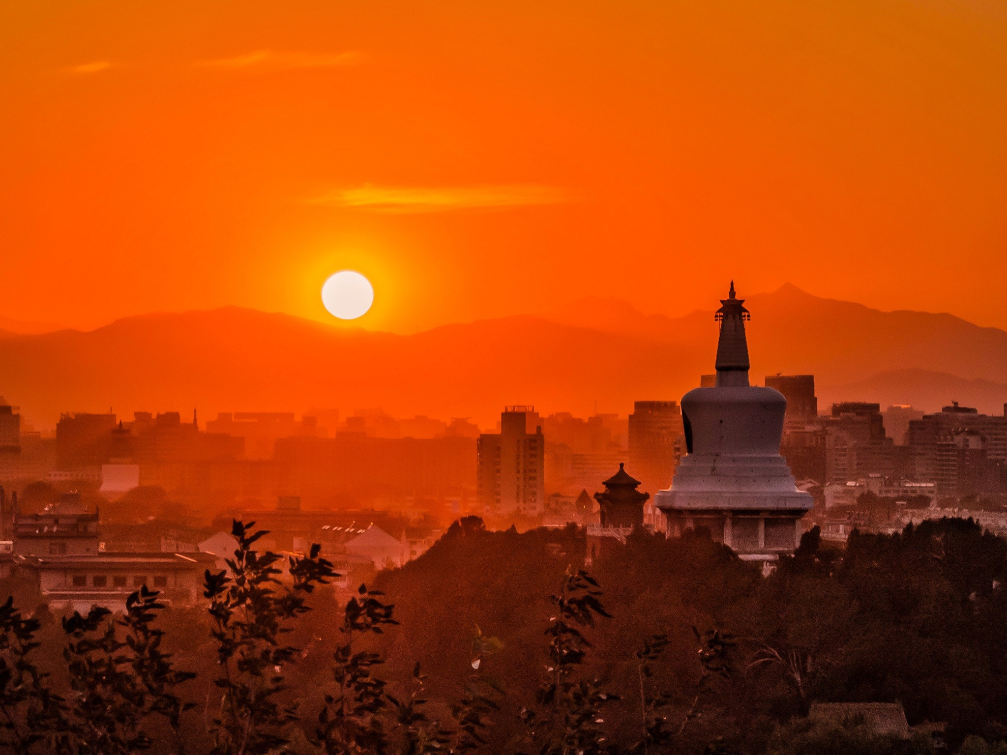 Olympus PEN E-PM2 sample photo. A glimpse of the "white tower temple" atop of "jing shan" - beijing in the last drop of sunlight  photography