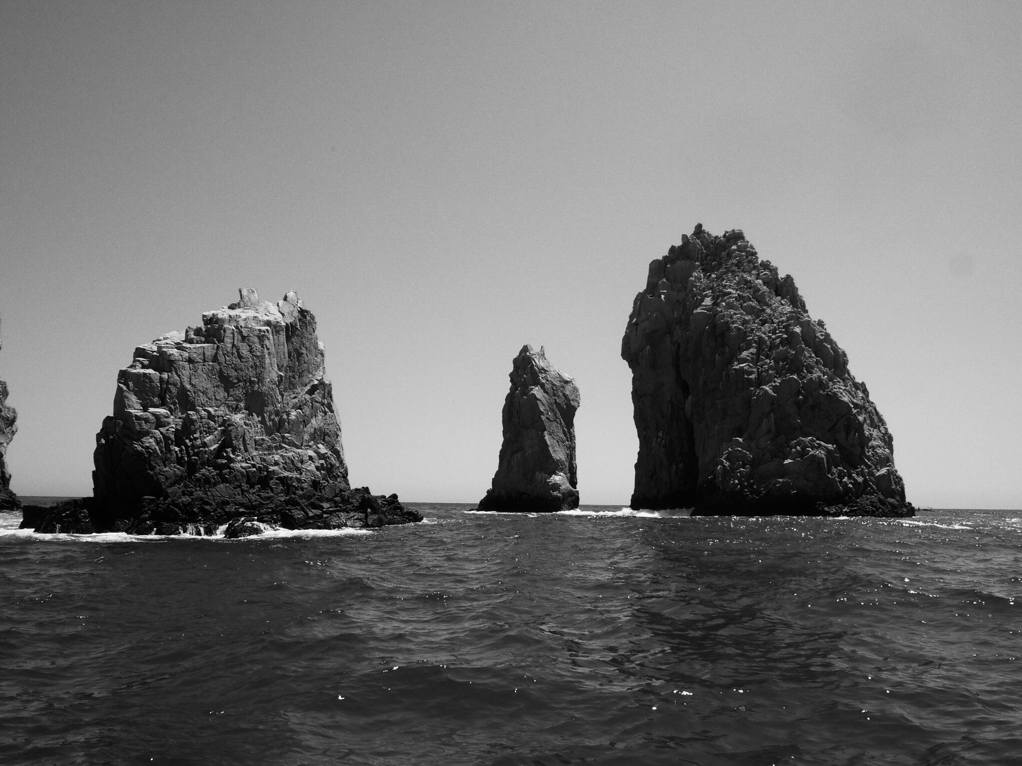 Olympus OM-D E-M1 + Olympus M.Zuiko Digital ED 14-42mm F3.5-5.6 EZ sample photo. End rocks of baja california, at cabo san lucas, mx b&w photography