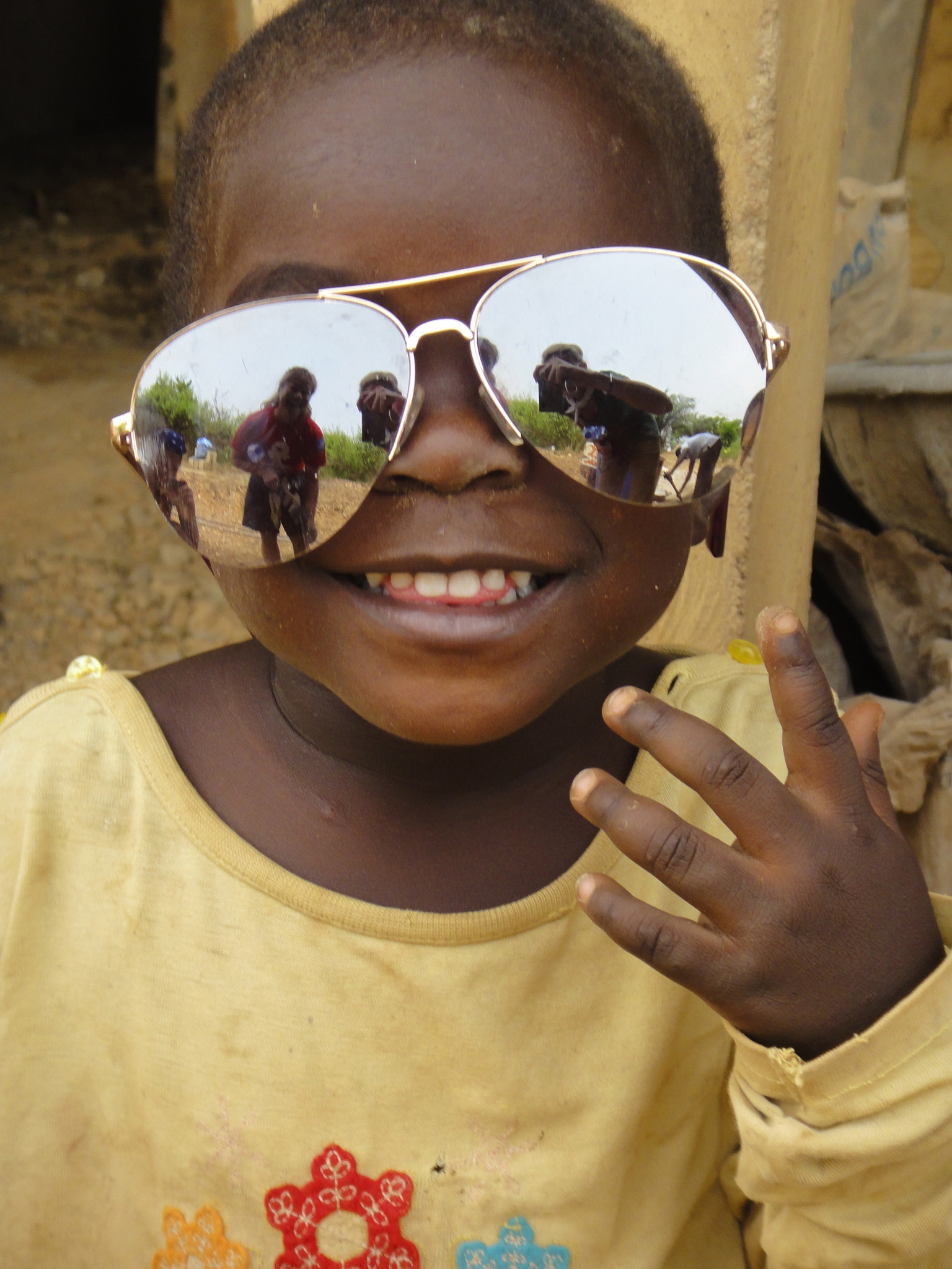 Sony DSC-TX7 sample photo. Africa, west africa, ghana, mirrored sunglasses, little boy, yellow shirt, village, child,... photography