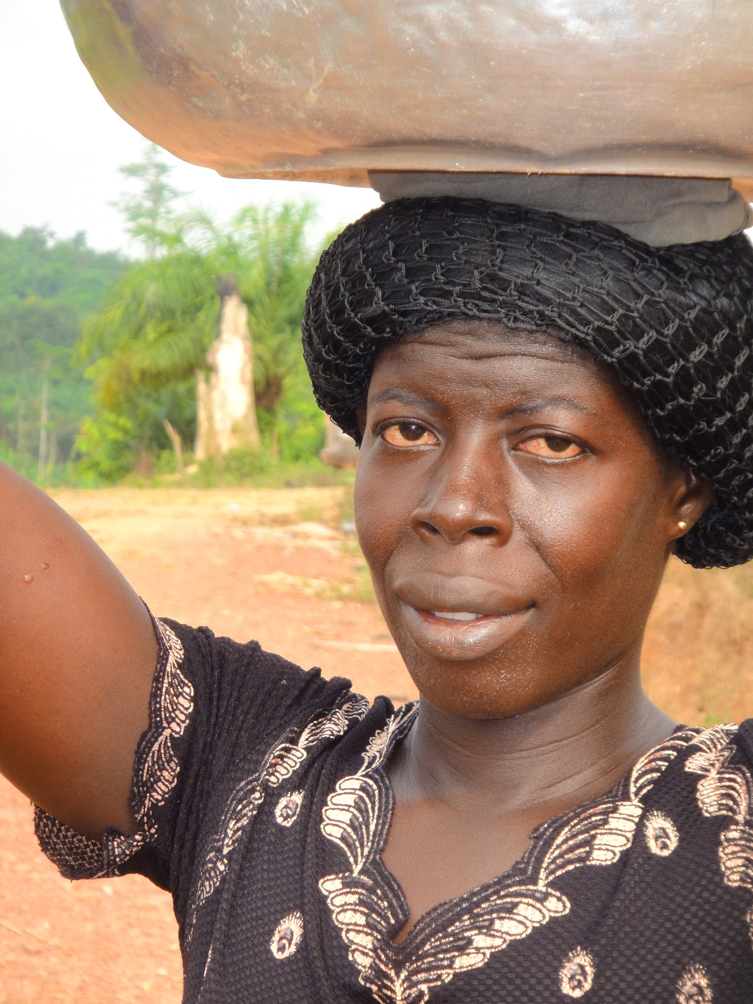 Sony DSC-TX7 sample photo. Africa, west africa, ghana, woman, hair net, village road, water jug on head photography