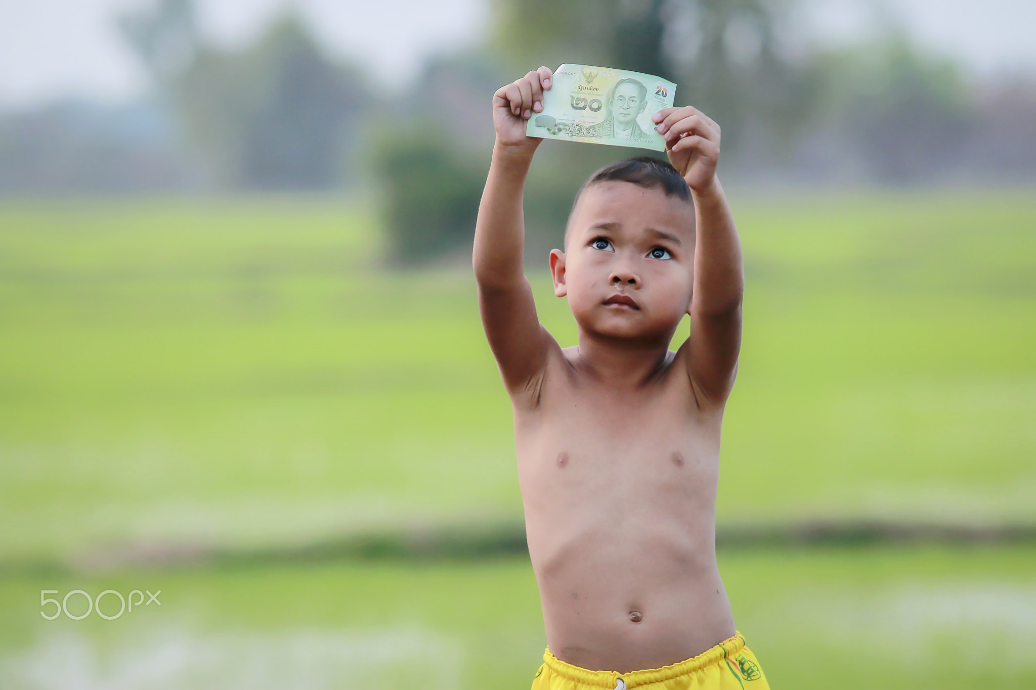 Rural children with a King of money Thailand .