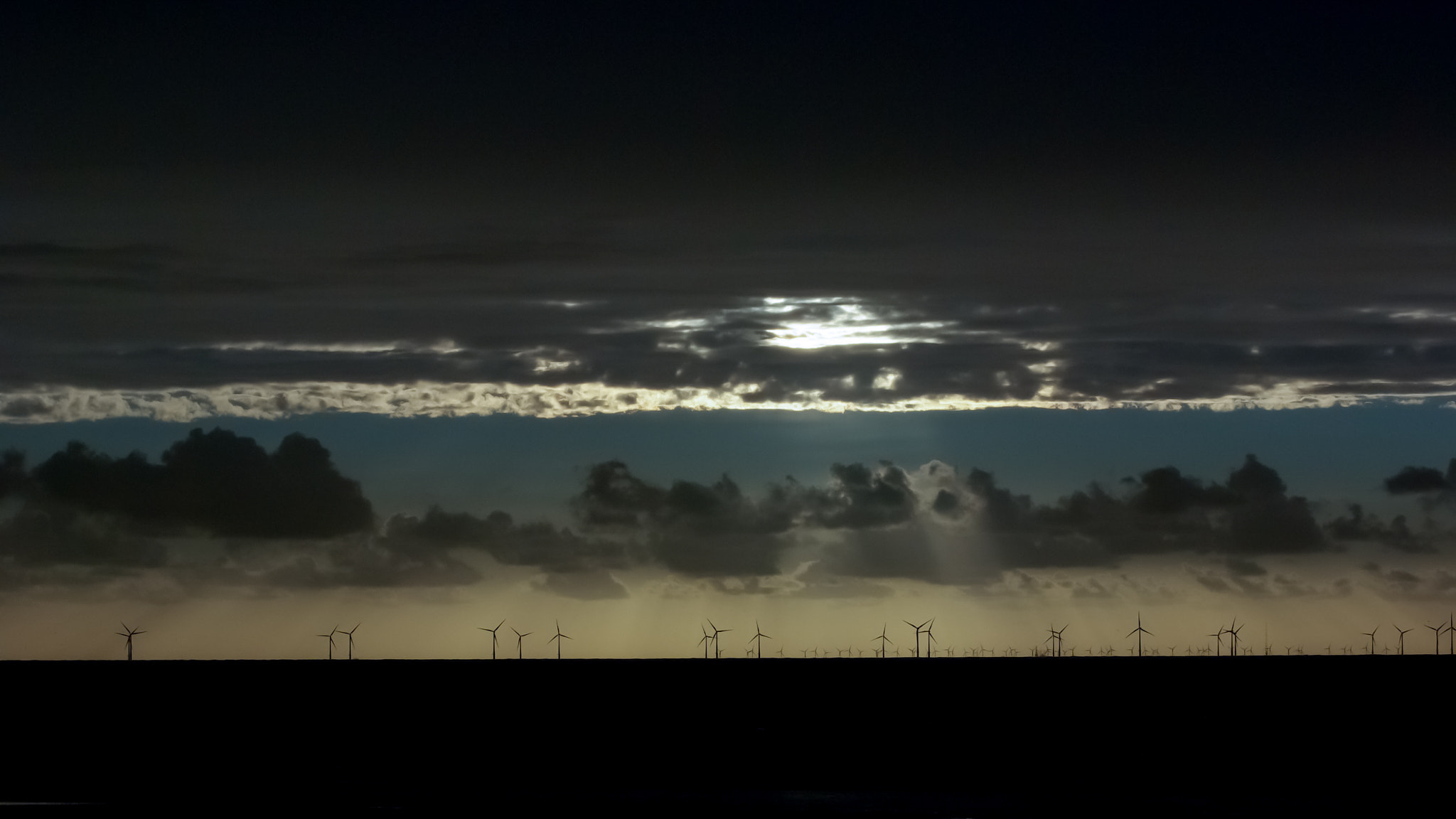 Pentax K10D sample photo. Dark cloudy sunset over the offshore windpark egmond aan zee (owez) photography