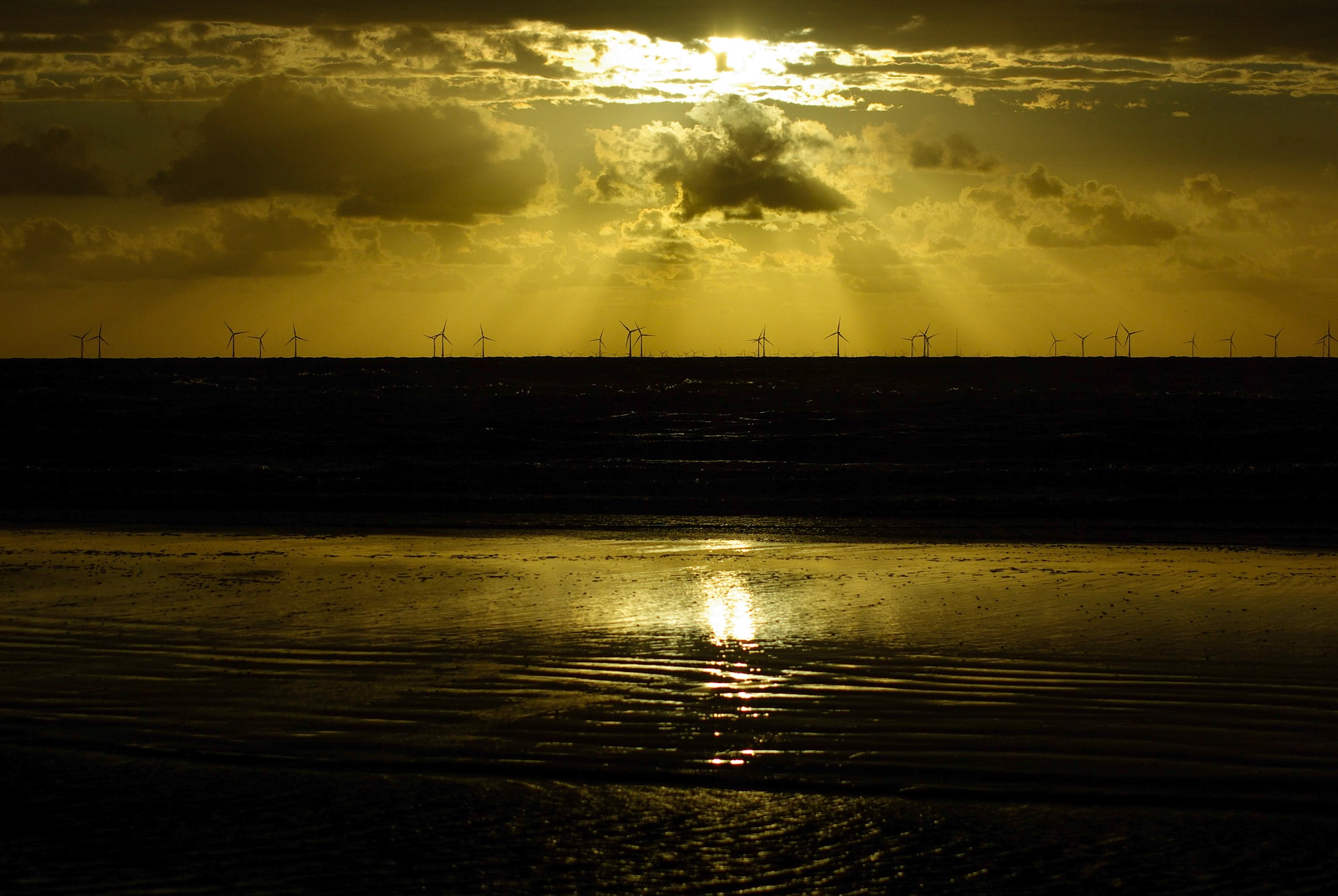 Tamron AF 70-300mm F4-5.6 Di LD Macro sample photo. Sun breaking through over the offshore windpark at golden sunset photography