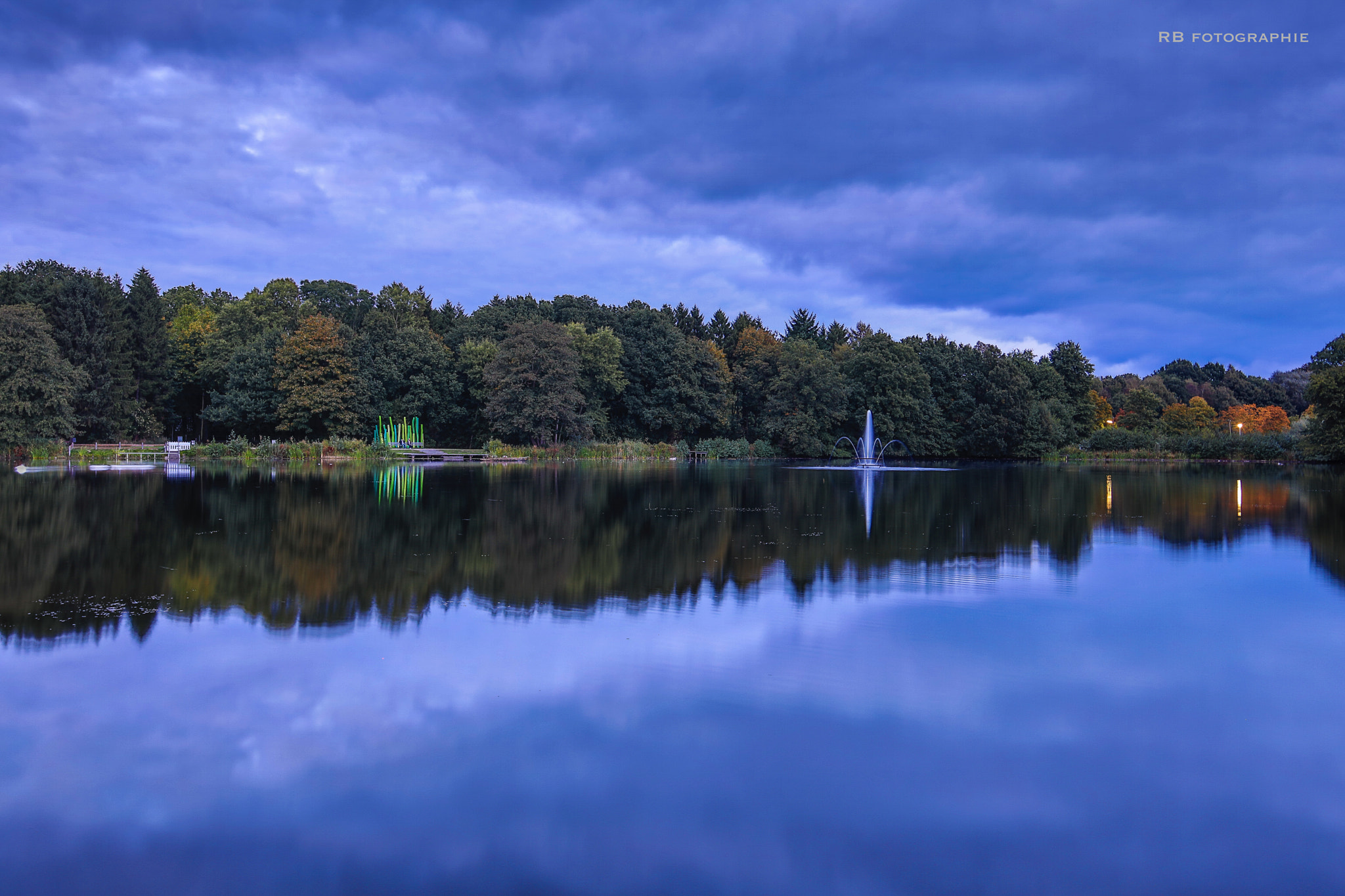 Canon EF 300mm f/2.8L sample photo. A small lake in bremerhaven germany on a fall evening.. photography