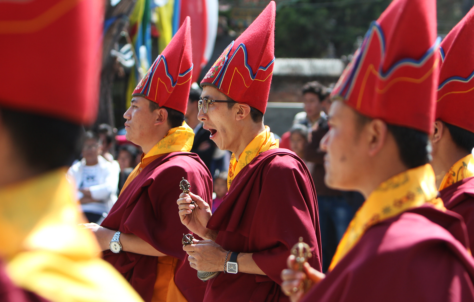Canon EF 70-200mm F2.8L IS USM sample photo. A monk yawns during prayer on the occasion of world peace prayers festival at hyolmo monastery in... photography