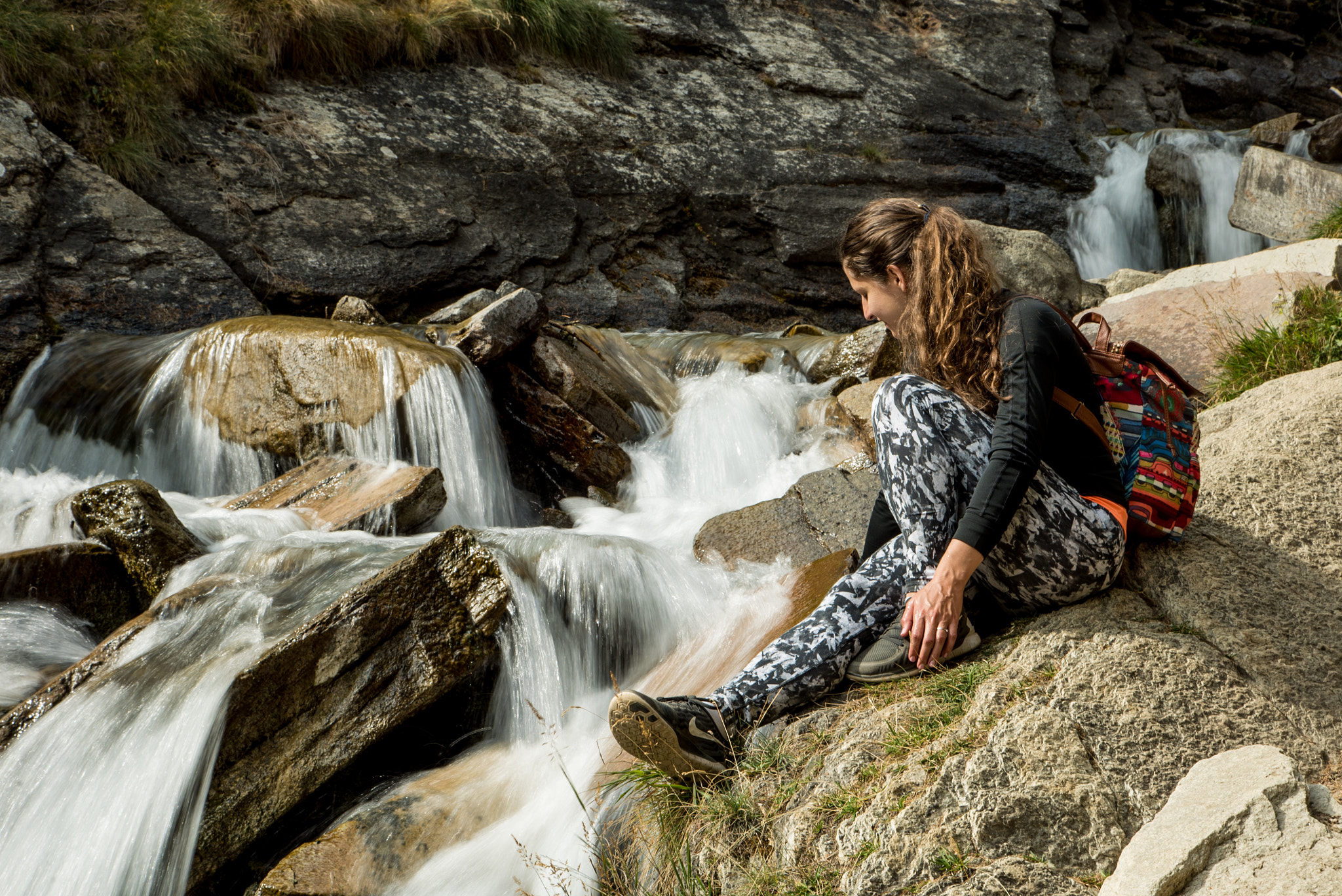 24-105mm F4 G SSM OSS sample photo. My wife next to a waterfall in the hills photography