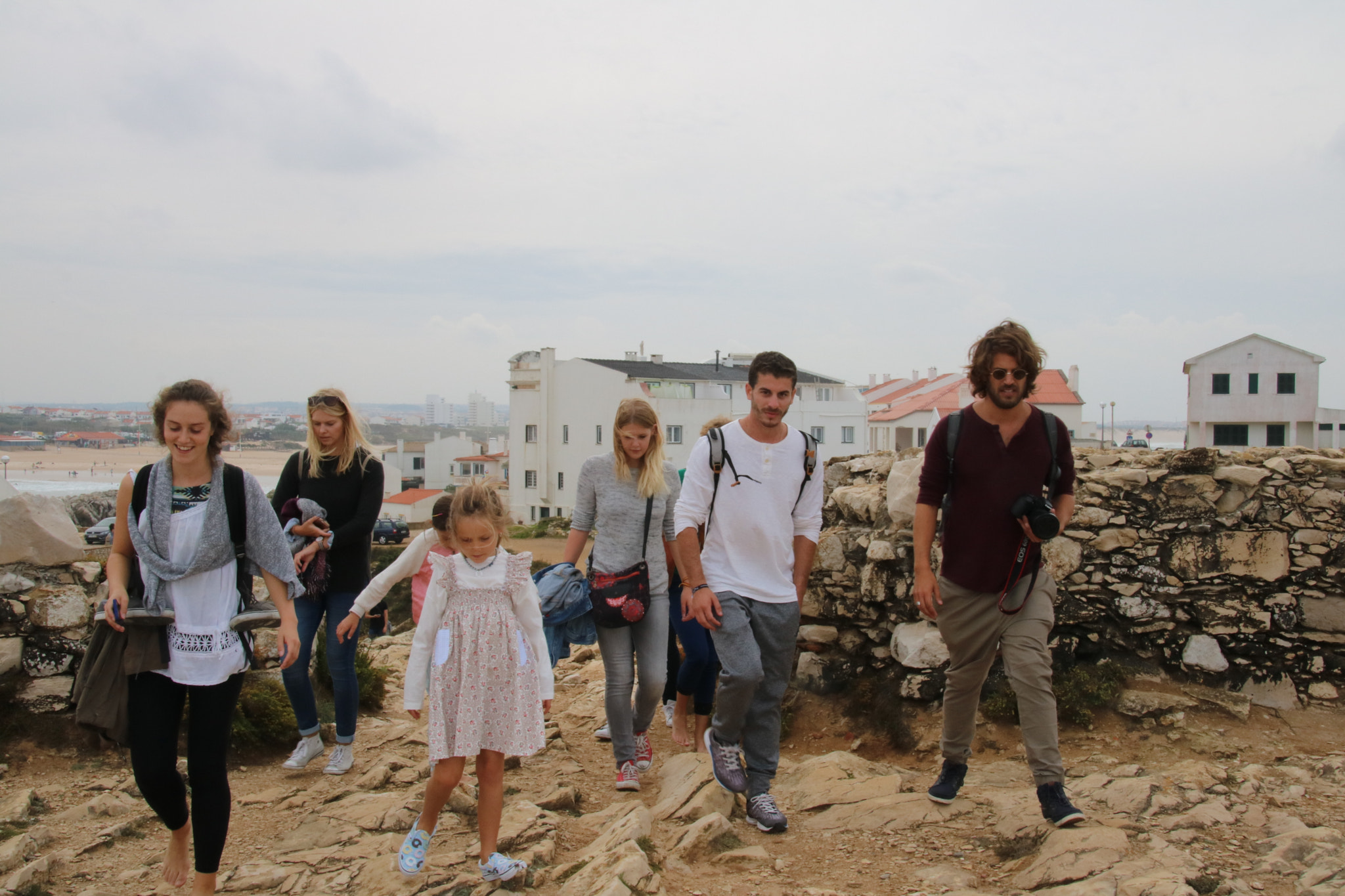 Sigma 18-250mm F3.5-6.3 DC OS HSM sample photo. Group exploring a rock photography
