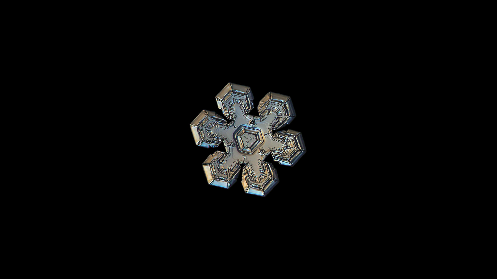 Canon POWERSHOT A650 IS sample photo. Snowflake isolated on black background photography