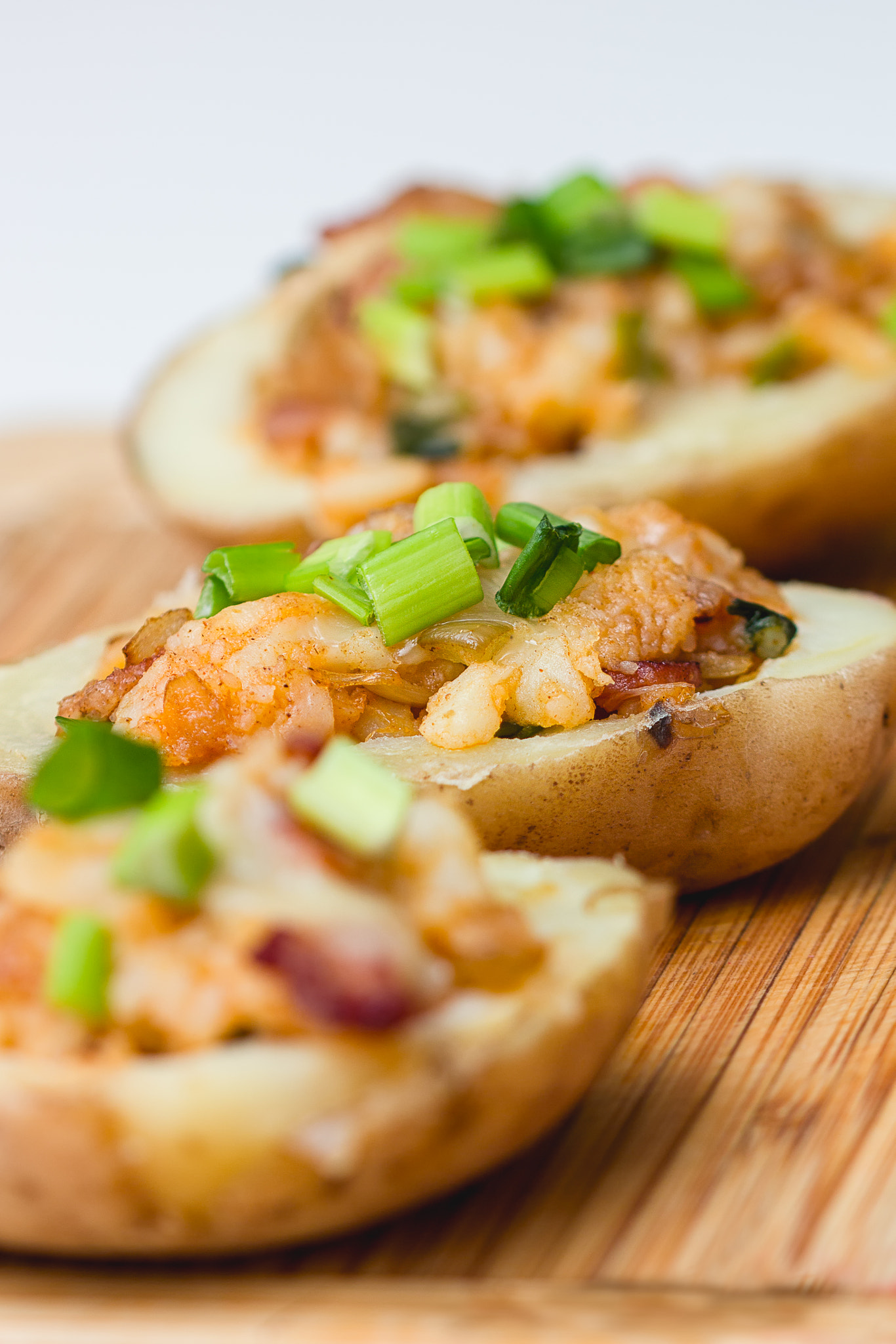 Canon EOS 60D + Sigma 105mm F2.8 EX DG OS HSM sample photo. Baked potatoes with cheese and bacon photography