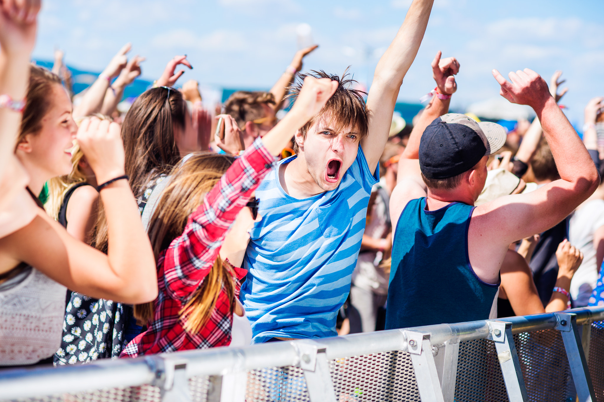 Nikon D4S + Nikon AF Nikkor 85mm F1.8D sample photo. Teenagers at summer music festival having good time photography