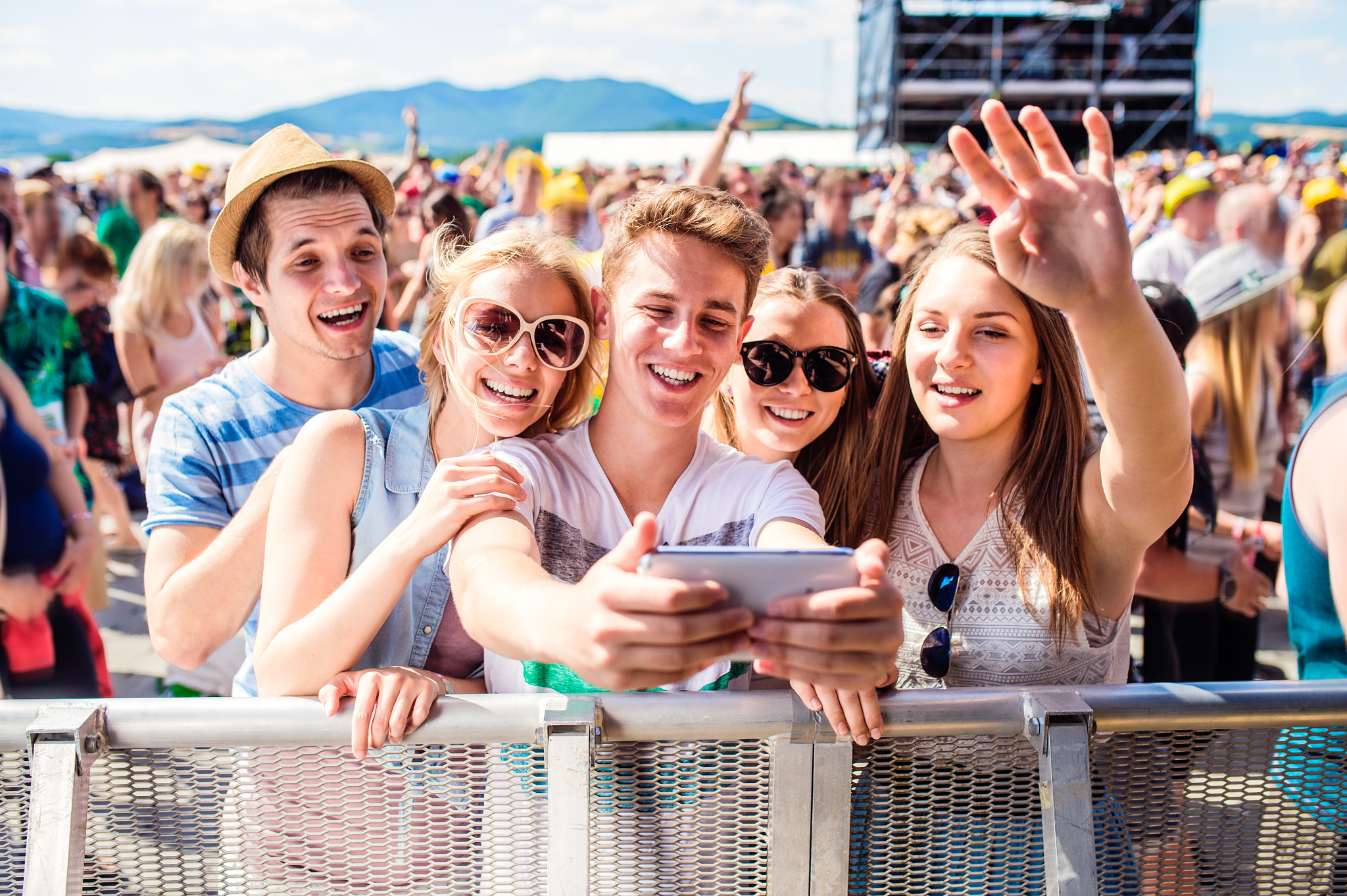 Nikon D4S + Sigma 35mm F1.4 DG HSM Art sample photo. Teenagers at summer music festival in crowd taking selfie photography