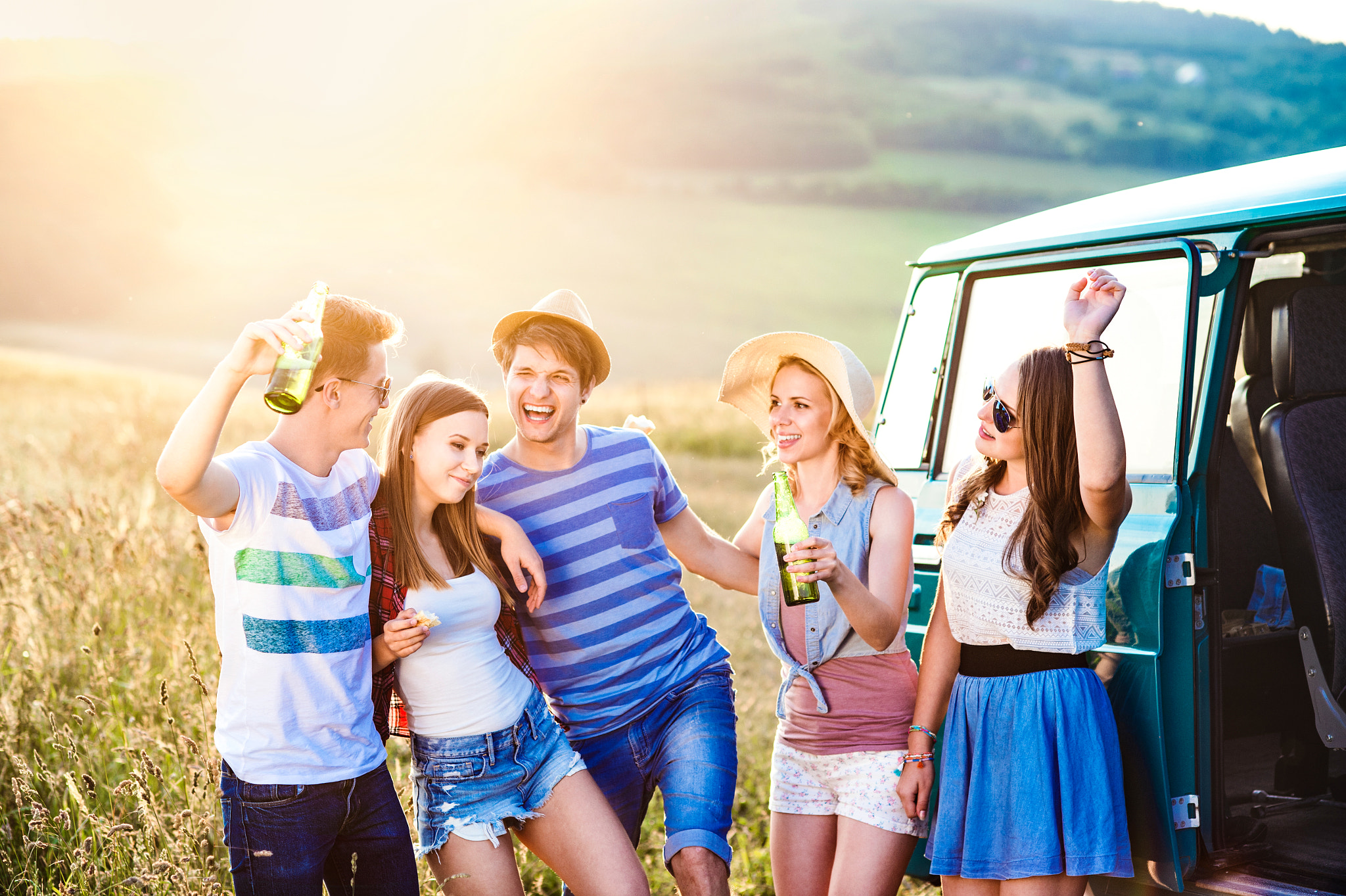 Nikon D4S + Nikon AF Nikkor 85mm F1.8D sample photo. Group of teenage hipsters on a roadtrip, drinking beer photography