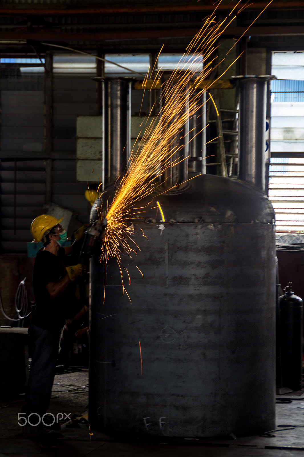 Canon EOS 600D (Rebel EOS T3i / EOS Kiss X5) sample photo. A worker grinding the steel photography